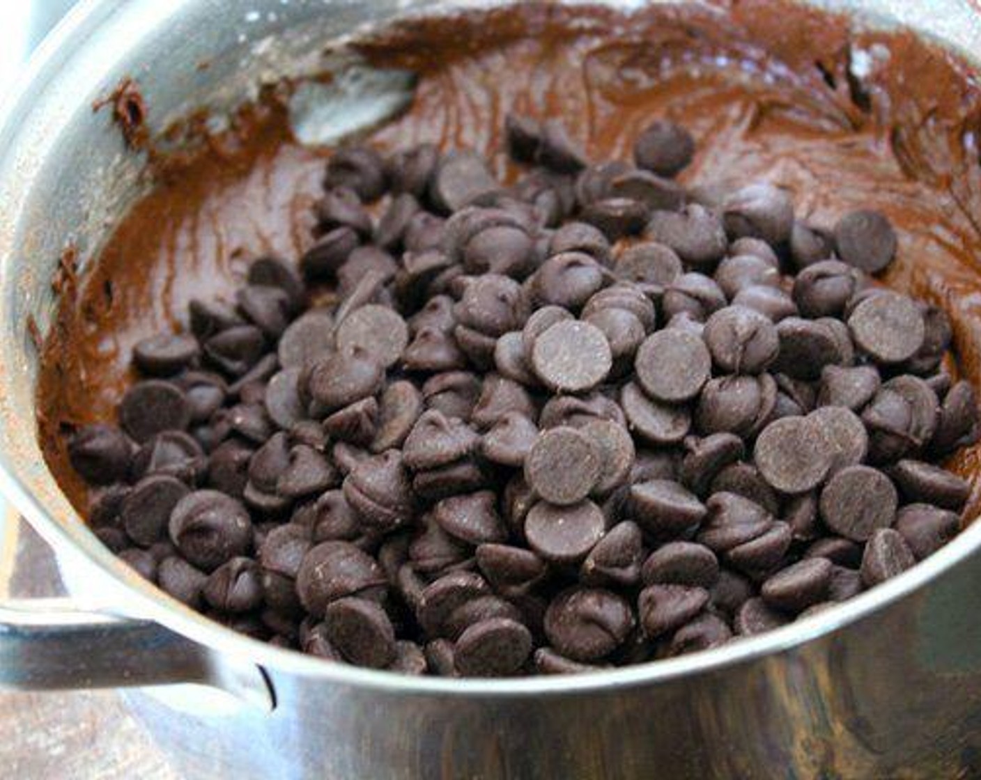 step 5 Add the All-Purpose Flour (1 1/2 cups), Unsweetened Cocoa Powder (1 cup), Baking Powder (1 tsp), and Salt (1/4 tsp). Stir well, then fold in the Semi-Sweet Chocolate Chips (2 cups).