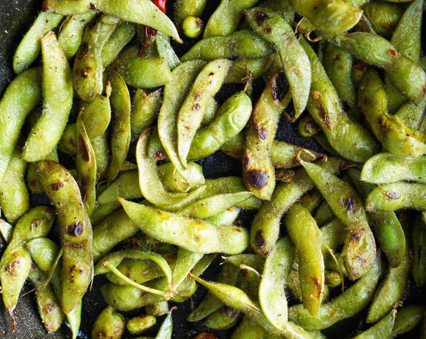 step 3 Add the Edamame (5 2/3 cups), toss to coat in oil and saute for 3-5 minutes, stirring frequently, until blistered. As the edamame cooks, season generously with Garlic Salt (to taste). Taste frequently and adjust as needed.