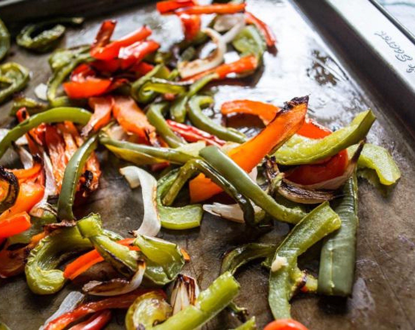 step 5 Spray baking sheet with cooking oil, and spread sliced Sweet Onion (1/2), Green Bell Pepper (1/2) and Red Chili Pepper (1/2) out into single layer and roast for 10-15 minutes or until edges begin to brown. Remove and set aside.
