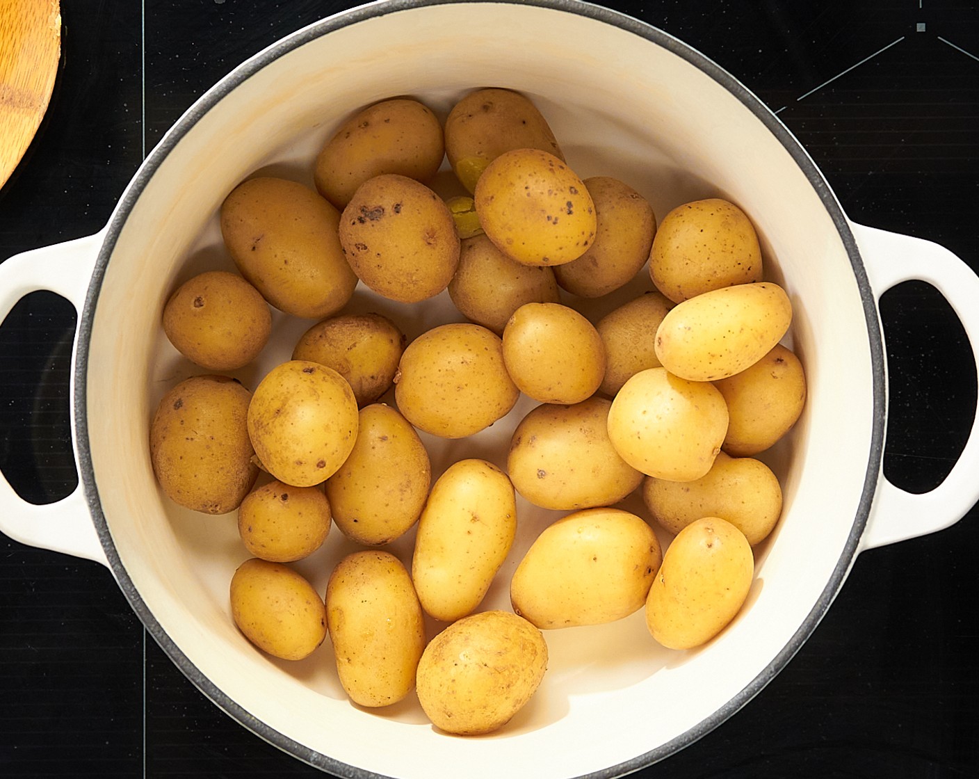 step 3 Potatoes are cooked when you can easily pierce them with a fork. Once cooked, drain the potatoes and add them back to the hot empty pot to help them dry out.