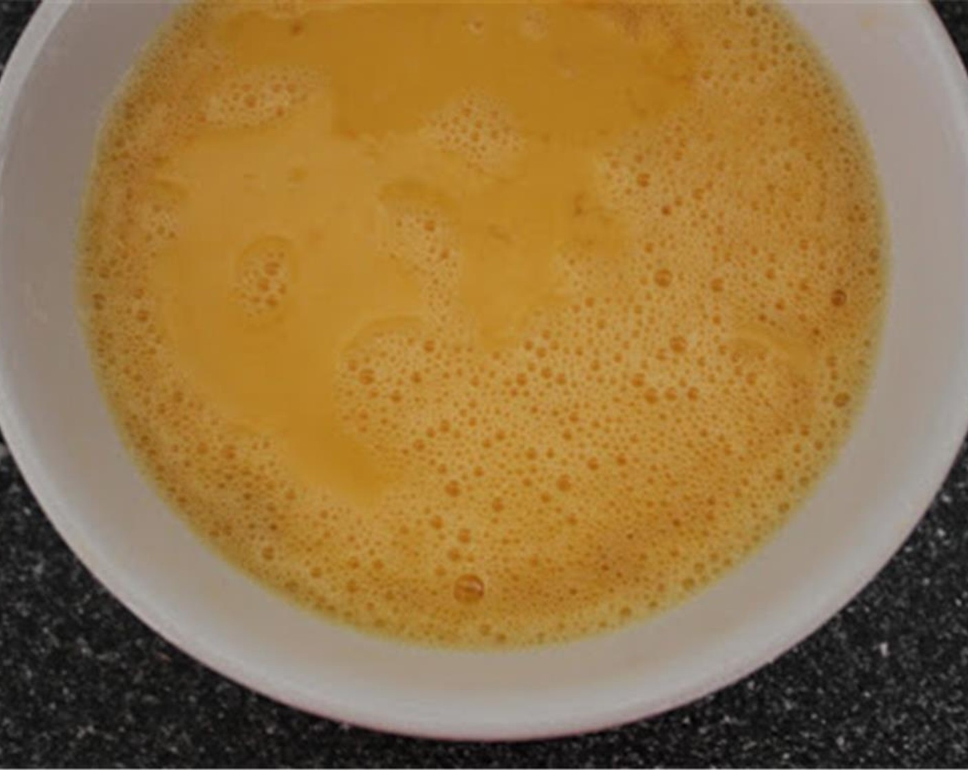 step 6 While the vegetables are cooking, lightly beat the Eggland's Best Classic Eggs (6), with the Water (1 Tbsp), Salt (1/2 tsp), and some Ground Black Pepper (to taste). Don't overmix the eggs!