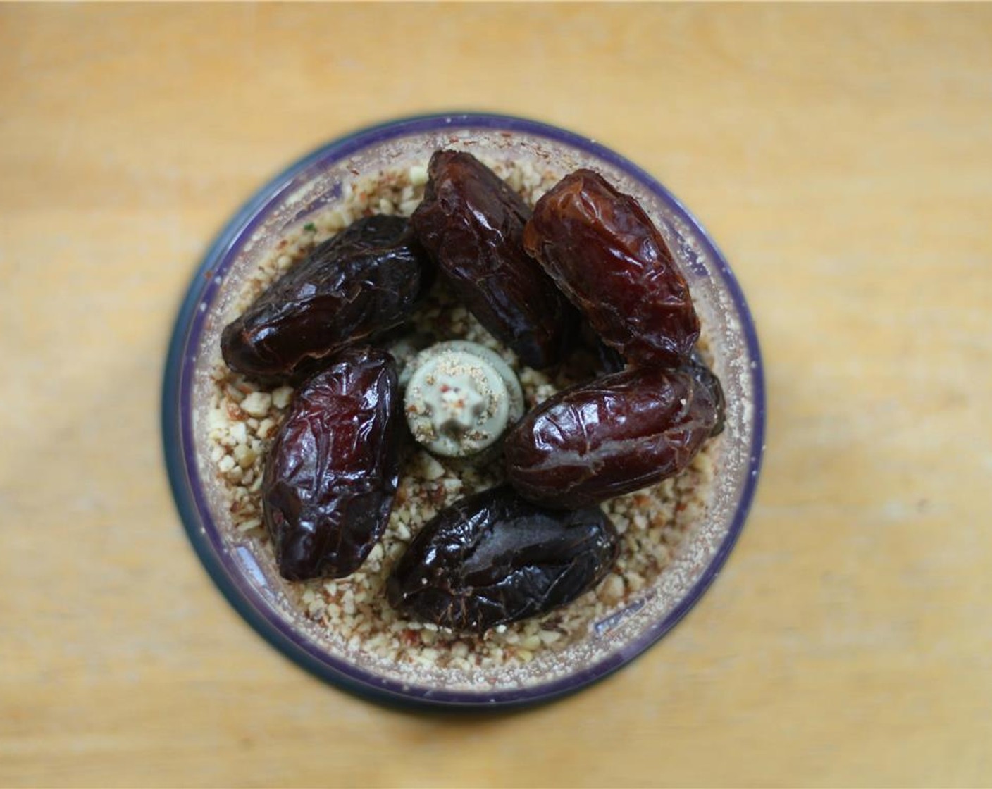 step 4 Place the Walnut (2/3 cup), Pecans (2 3/4 cups), and Sliced Almonds (1 cup) in a food processor until they are finely chopped. Add the Dates (10) and pulse until the nuts just begin to hold together.