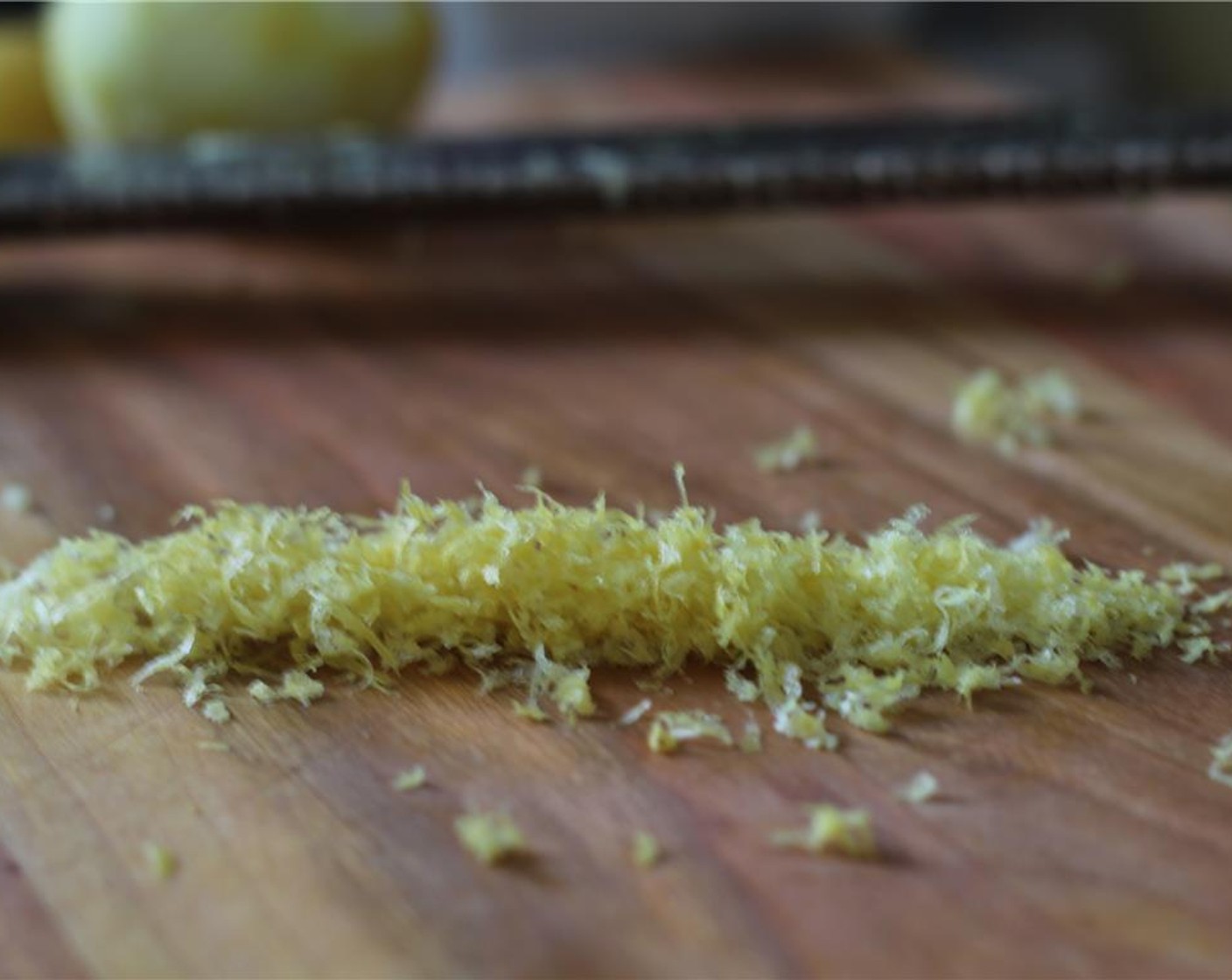 step 2 Grate the Garlic (2 cloves) and zest the Lemon (1/8).