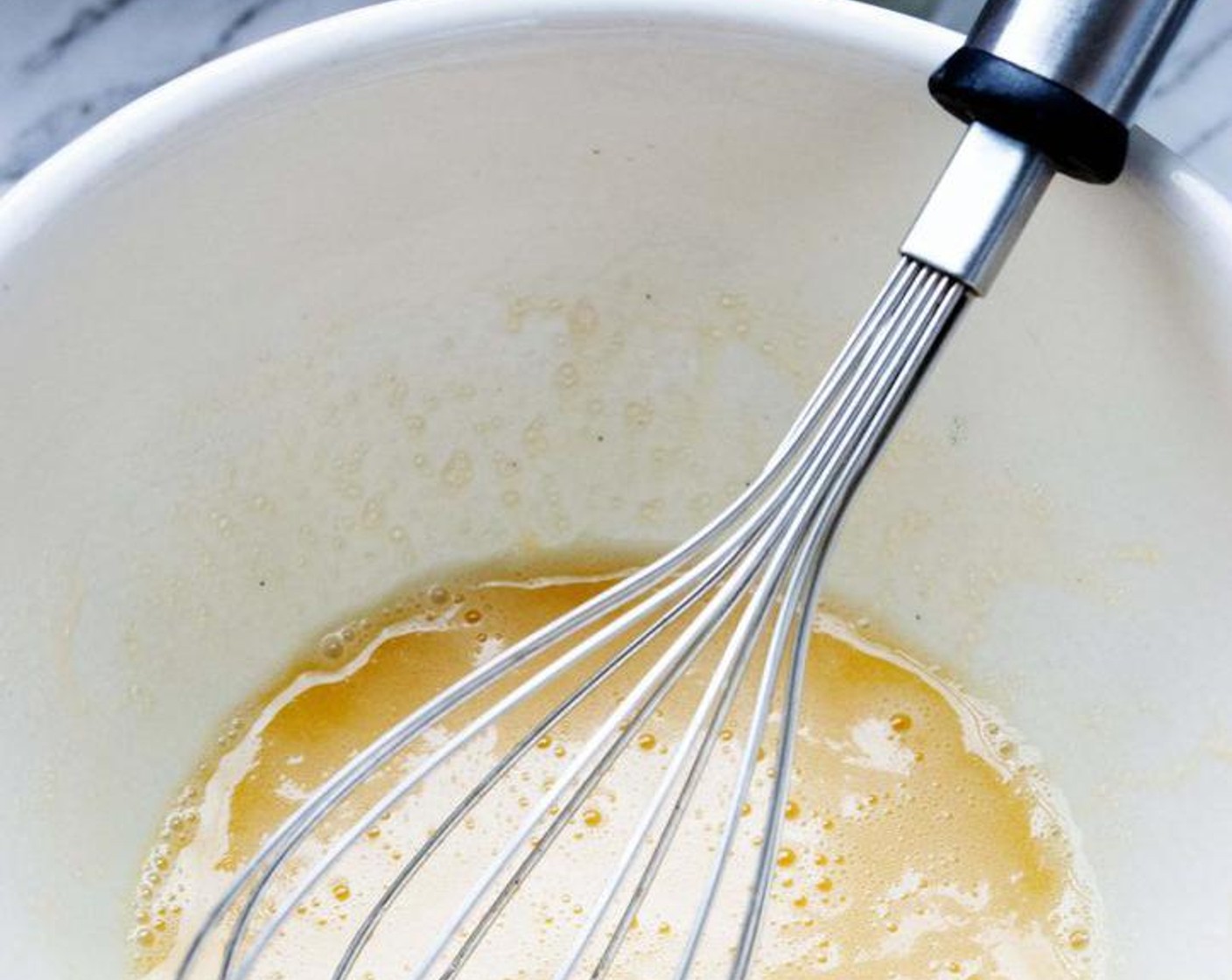 step 2 In a large bowl, beat up Farmhouse Eggs® Large Brown Egg (1) and Coconut Oil (1 oz).