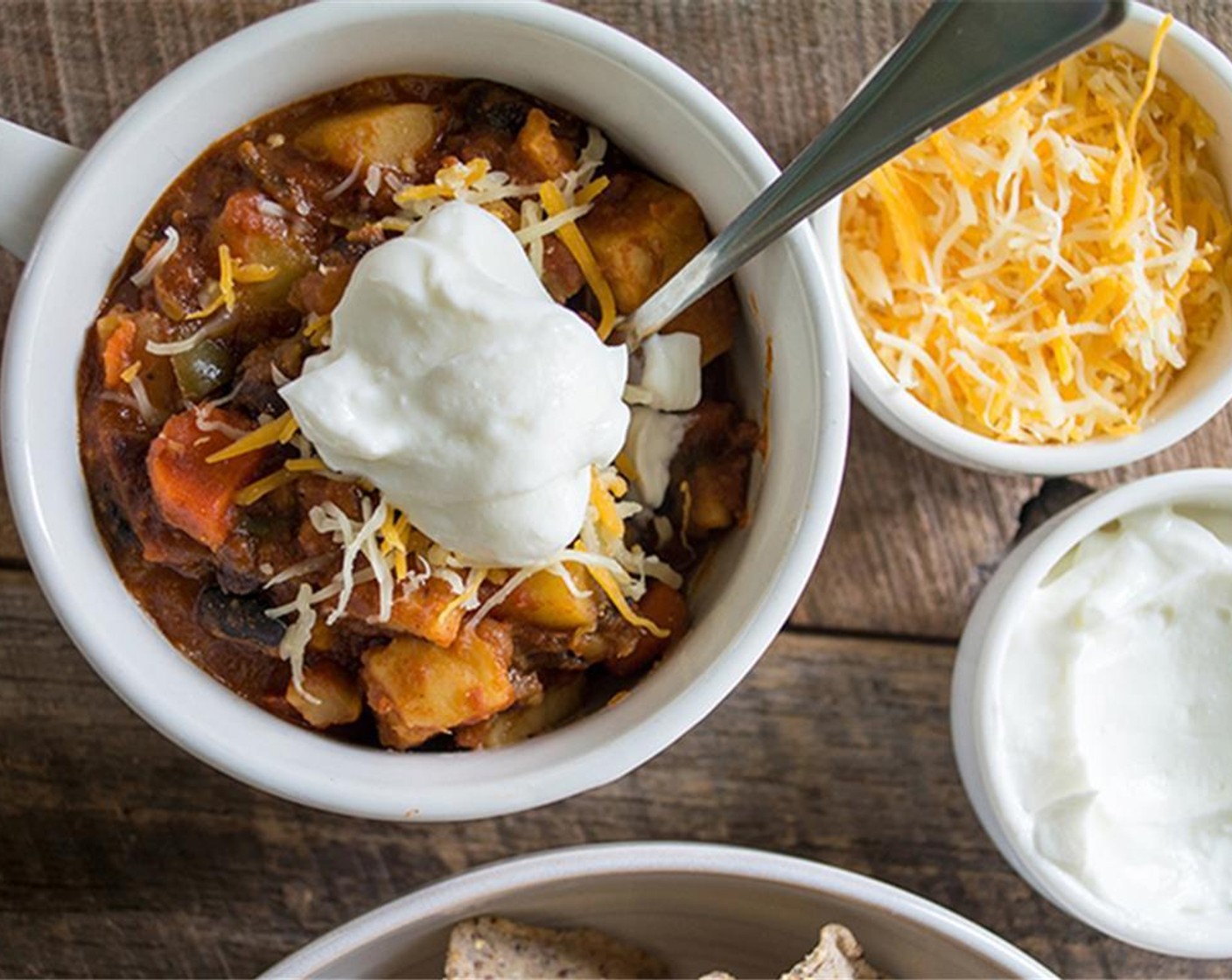 step 4 Served in bowls, topped with Shredded Cheese (to taste), Sour Cream (to taste), and Tortilla Chips (to taste). if desired!