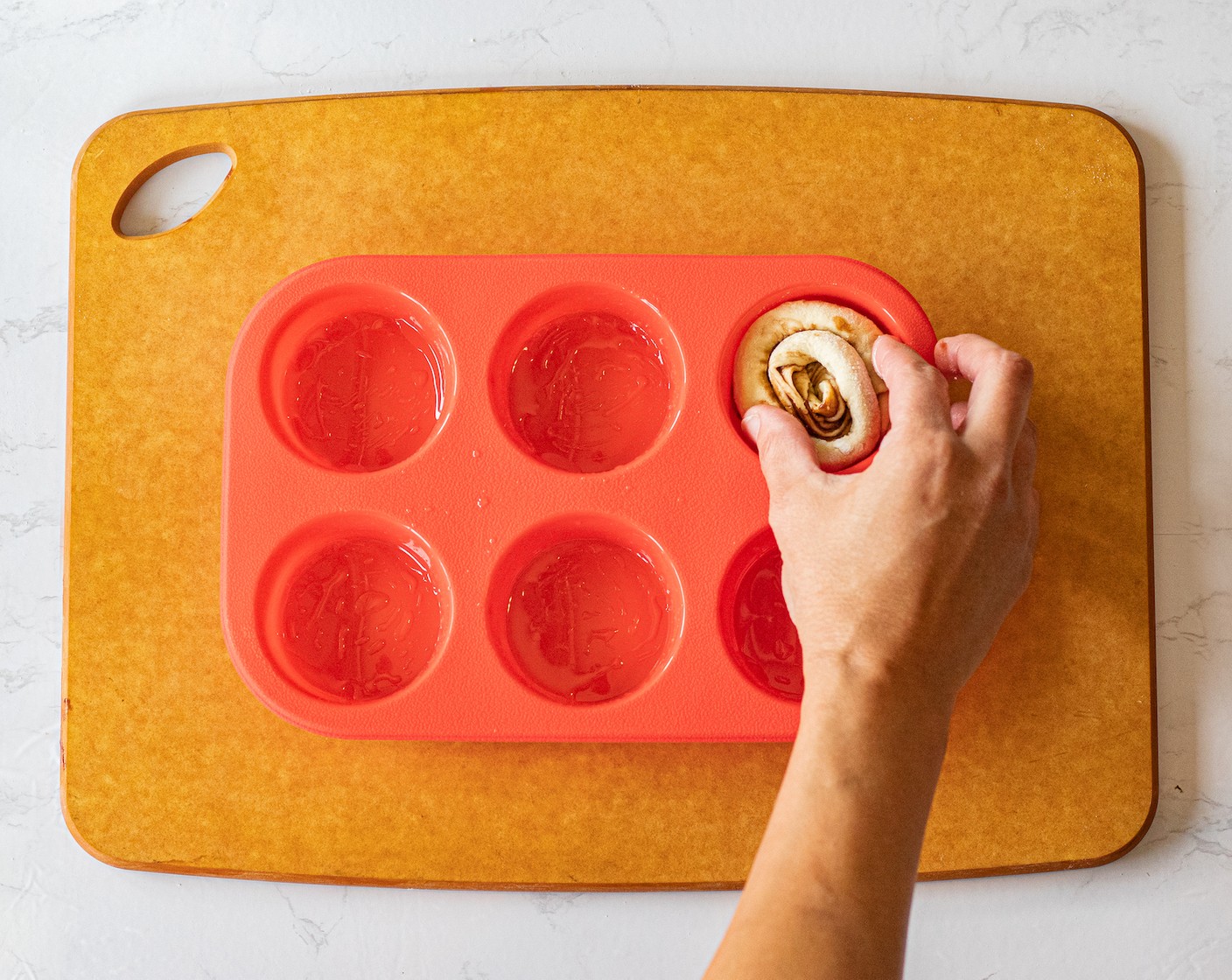 step 8 Place each wheel in the muffin tin.