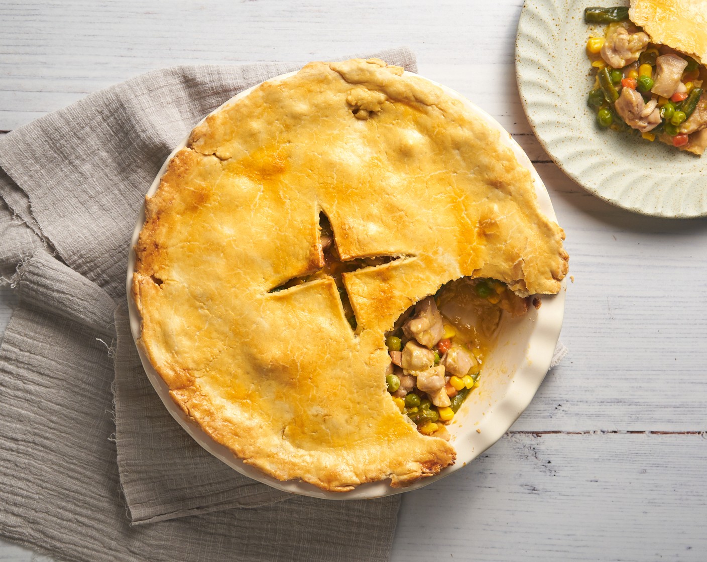 step 8 Let the pie stand for 10 minutes before serving. Garnish with parsley on top.  Enjoy it warm!