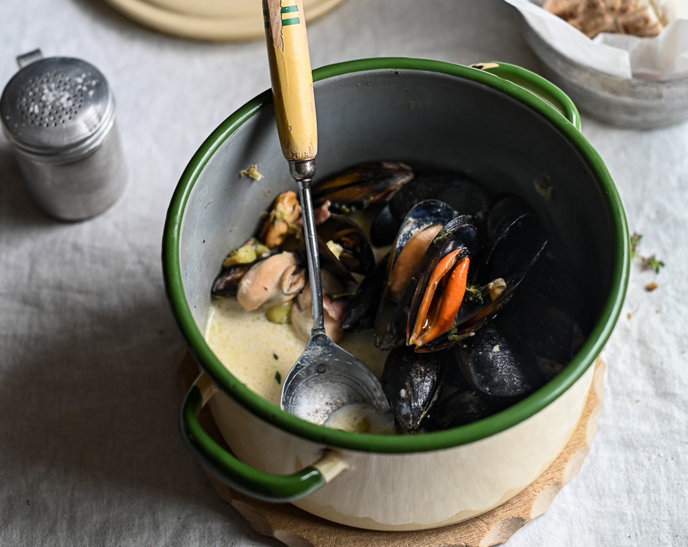 step 8 Once the sauce has thickened, add in the Fresh Mussels (4.4 lb) (their liquid will loosen up the sauce again.) Cover the dish with its lid and steam for about 6 to 8 minutes, or until all the mussels have opened, and work the shell wider with the tip of a butter knife.