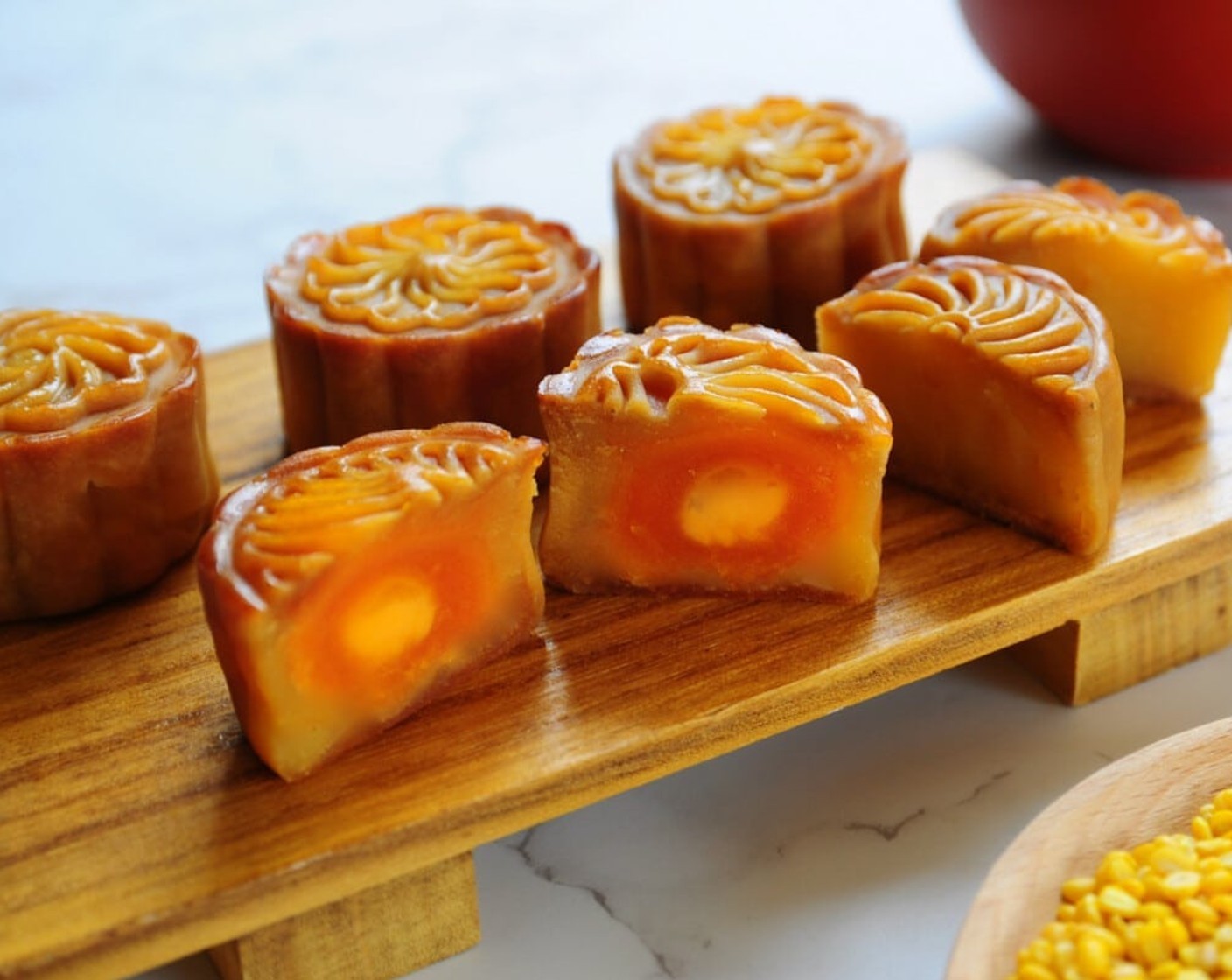 step 21 Remove from oven and let mooncakes cool on the tray for about 5 minutes. Then, transfer the baked mooncakes to cool completely on a wire rack. Cut into small slices and enjoy with hot brewed tea.