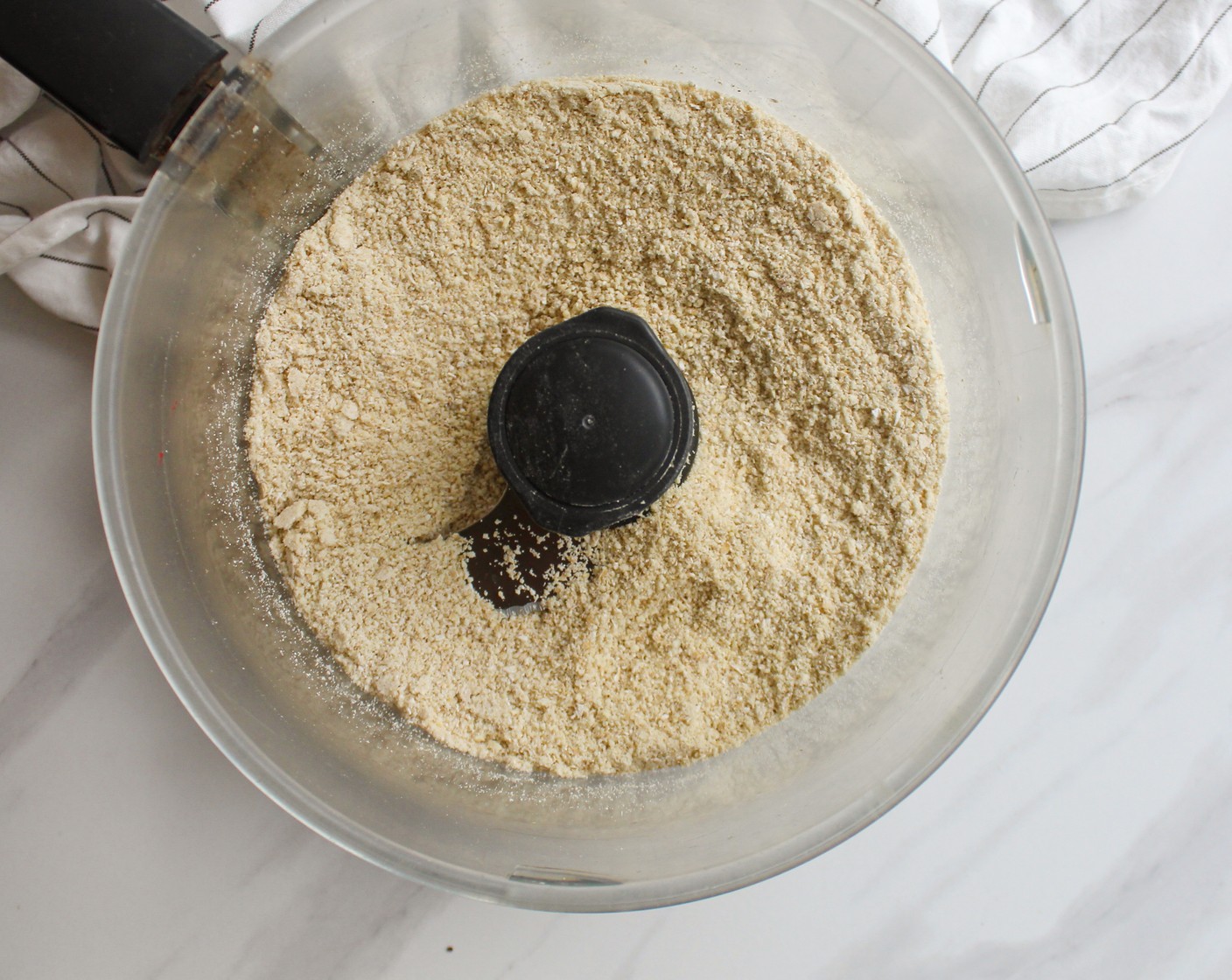 step 2 In a food processor or high-speed blender, blend together Old Fashioned Rolled Oats (1 cup) and Raw Cashews (1 cup) until fine powder forms.