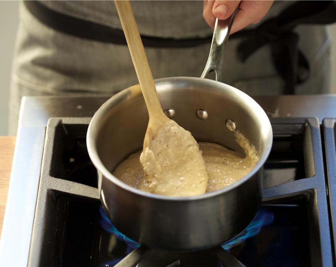 step 7 Transfer the mashed cannelini beans back into the small saucepan and keep on low heat until plating.