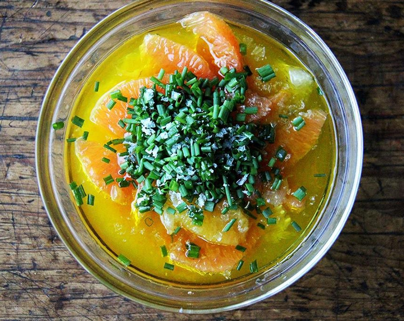 step 7 Meanwhile, pour the remaining 2 tablespoons olive oil into the bowl with the citrus segments. Add the Fresh Chives (2 Tbsp) and Sea Salt Flakes (1 pinch). Stir to combine. Taste. It should taste similar to a salad dressing with perhaps less of a bite.