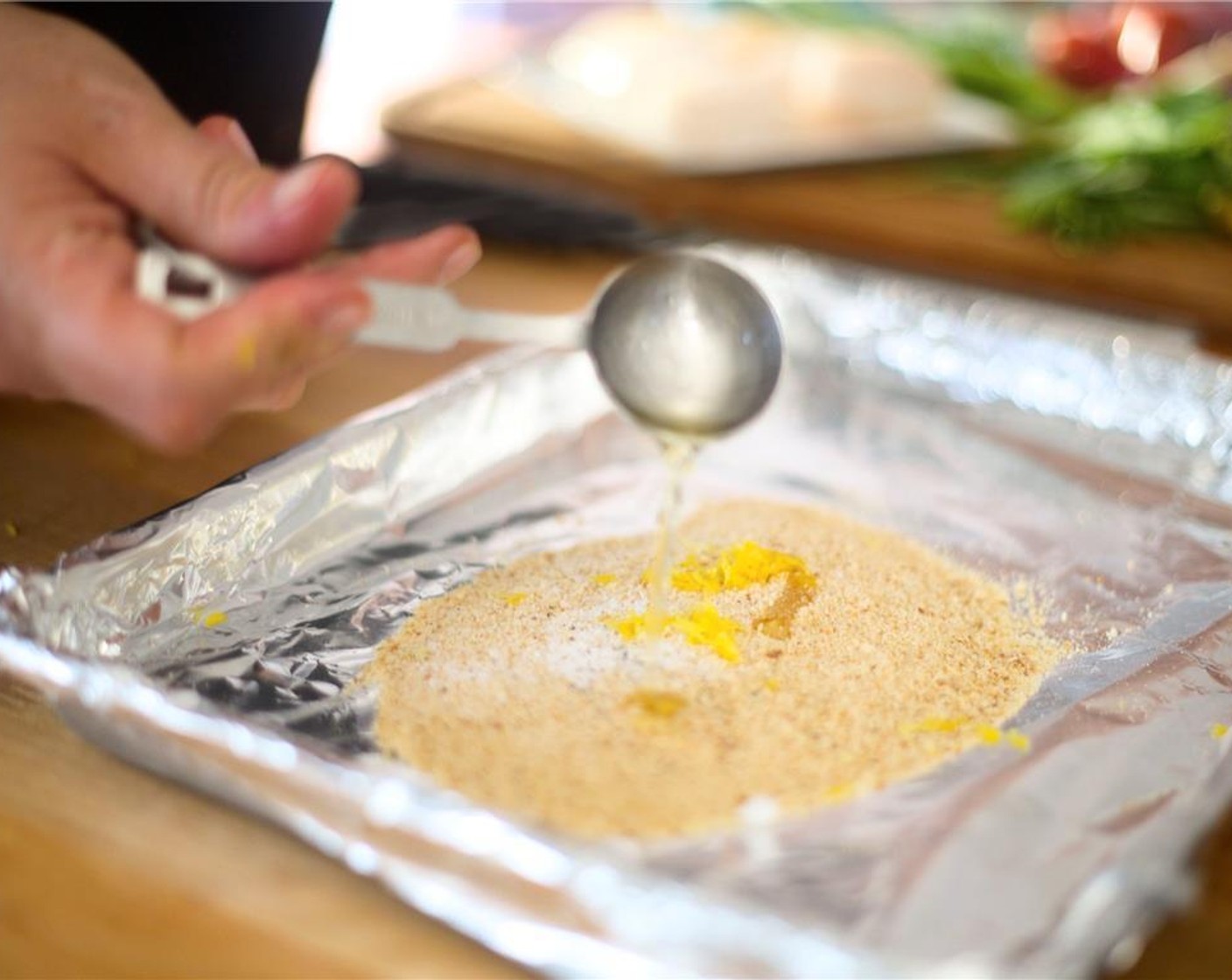 step 3 Add Oil (1 Tbsp) and mix well. Lay crumbs evenly and bake for three minutes.