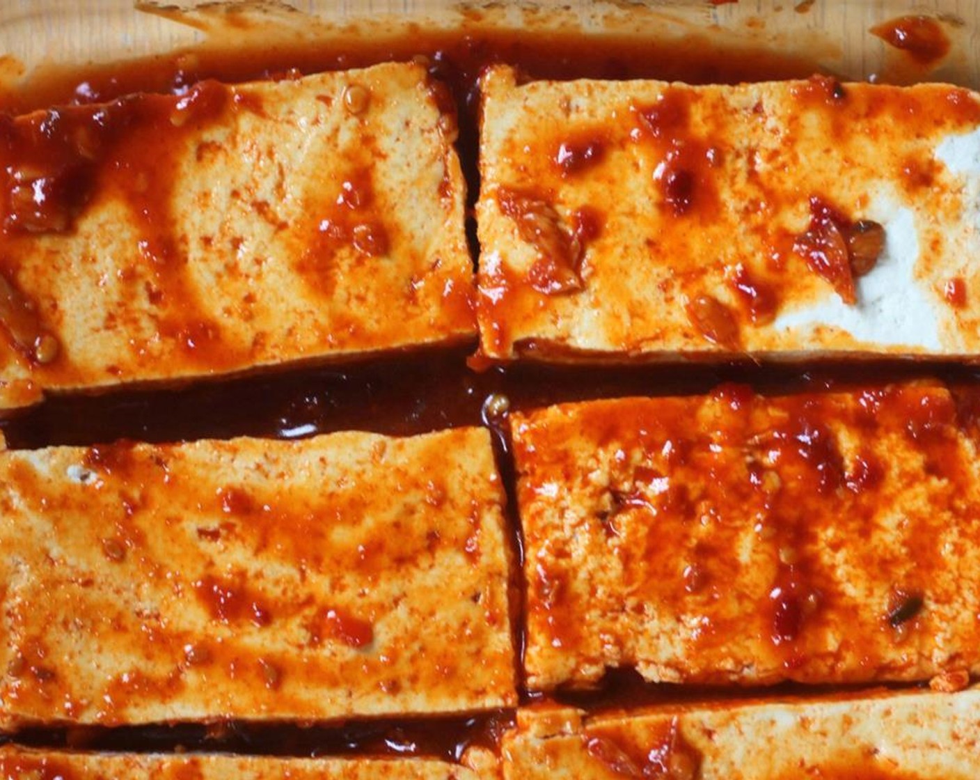 step 3 Coat the tofu slabs with most of the sauce in a small baking dish.