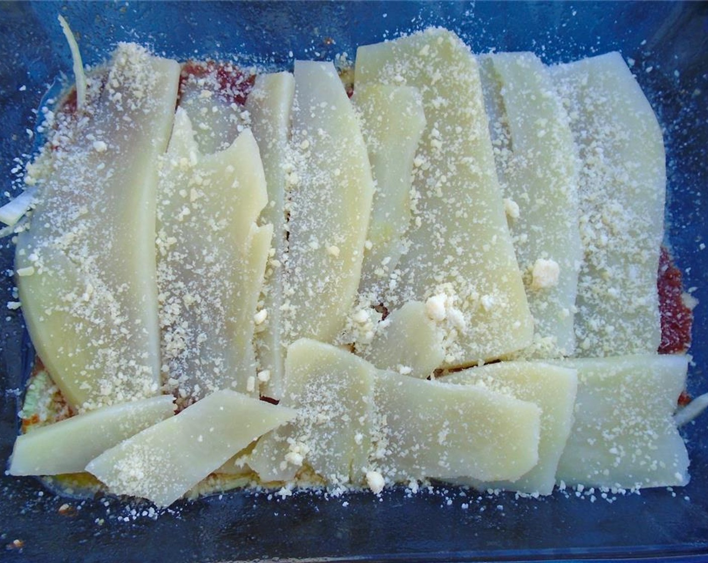 step 8 Top with a layer of potatoes. Sprinkle with parmesan.