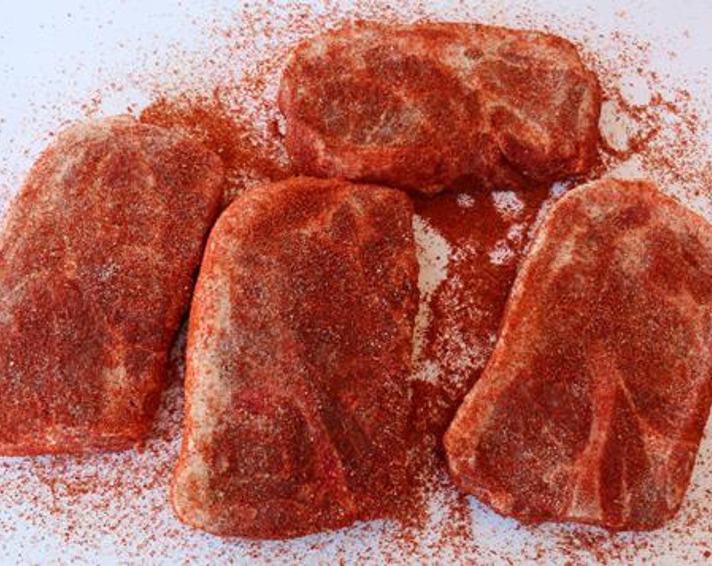 step 2 Season the outside of each Boneless Pork Shoulder (4) with All-Purpose Spice Rub (1/4 cup) followed by Barbecue Rub (1/4 cup). Substitute your favorite seasonings if you wish. Pork shoulder should be around 1 1/4-inch thick.