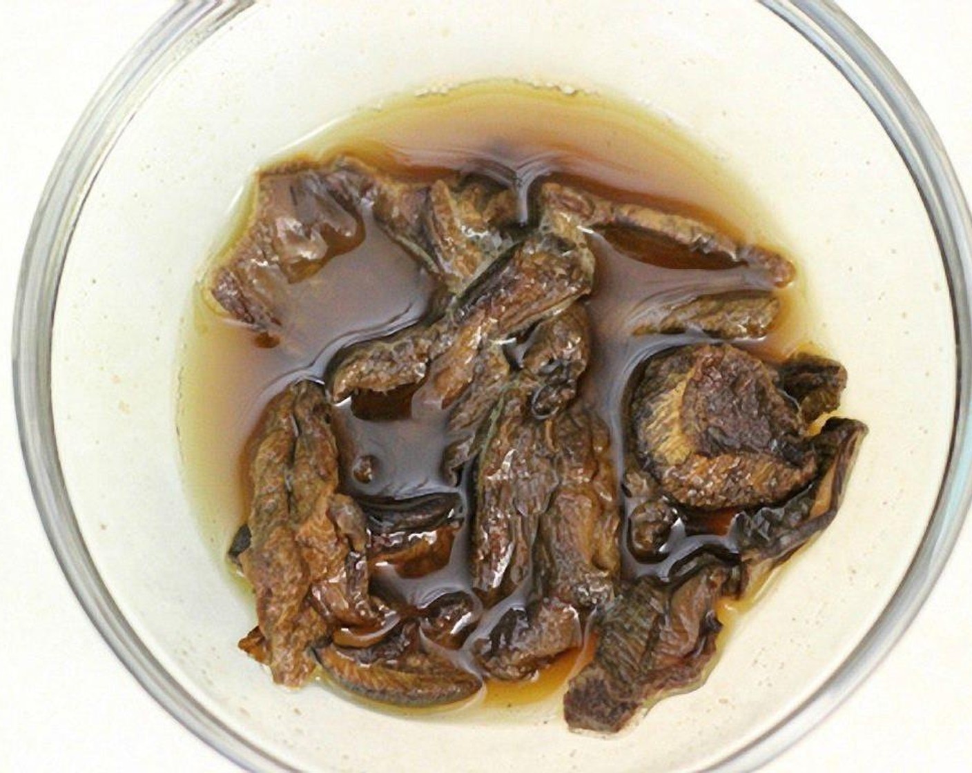 step 5 In a small bowl, place the Dried Porcini Mushrooms (2 Tbsp) and cover with water. Cover with plastic wrap, poke a few holes in it and microwave for a few minutes until the mushroom are softened.