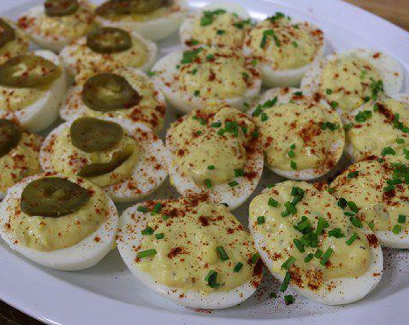 step 3 Garnish the eggs with Pickled Jalapeño Peppers (to taste), Fresh Chives (to taste) and Sweet Paprika (to taste). Loosely cover and chill in the refrigerator until ready to serve and enjoy.