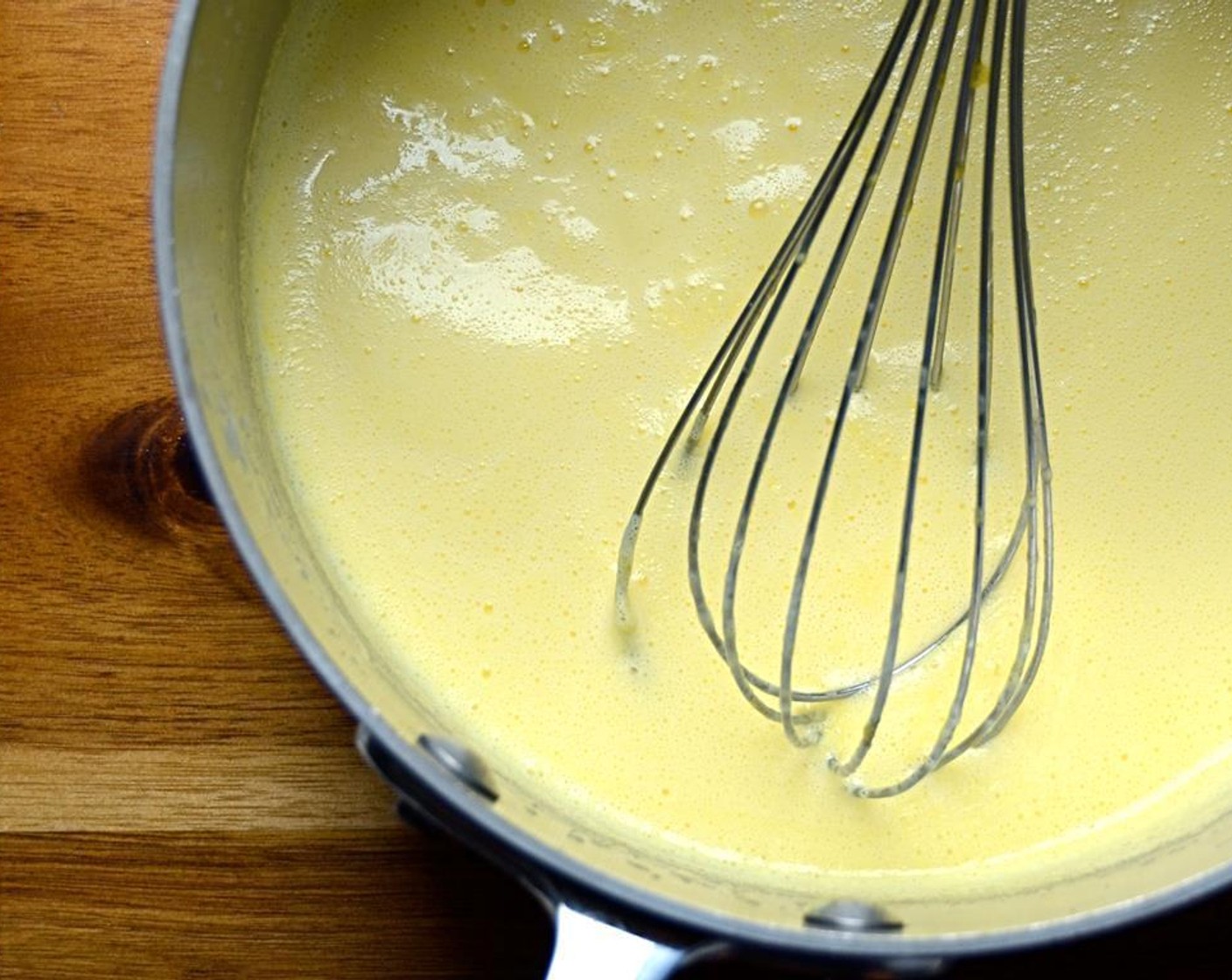 step 6 Pour the egg mixture back into the pot and stir constantly over medium low heat until custard thickens slightly. Remove from heat.