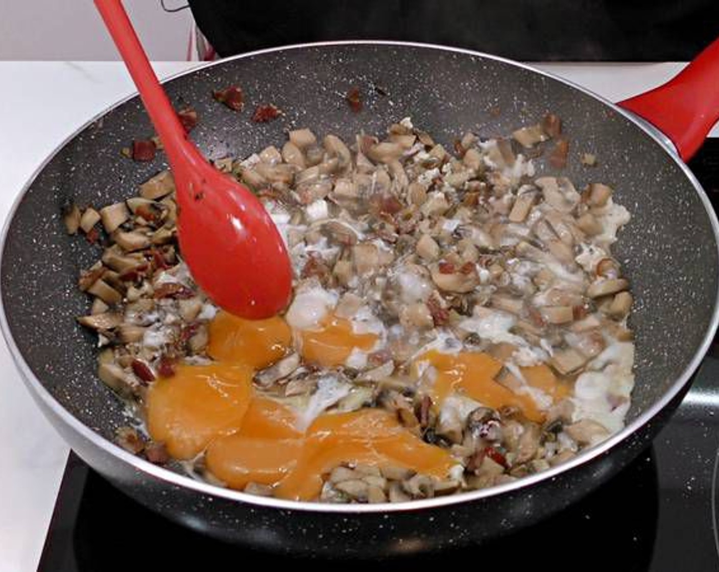 step 4 After the egg whites start cooking we can break the yolks and mix all together. Depending on how well you want the eggs to be you can let it cook on the stove more or less time.