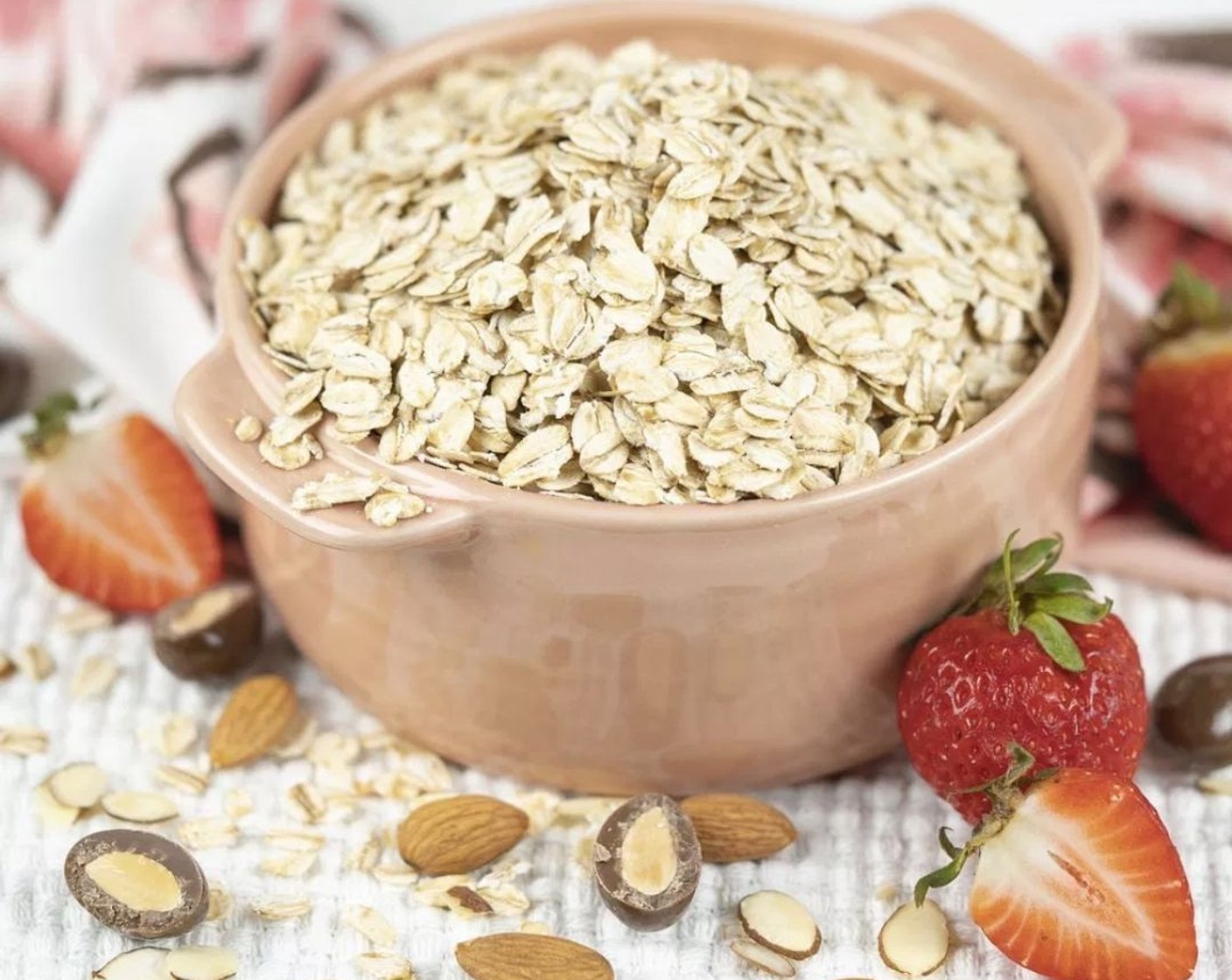 step 3 In a large bowl, stir together Old Fashioned Rolled Oats (4 cups), Sliced Almonds (1 cup), Unsweetened Cocoa Powder (1/2 cup), and Kosher Salt (1/4 tsp).