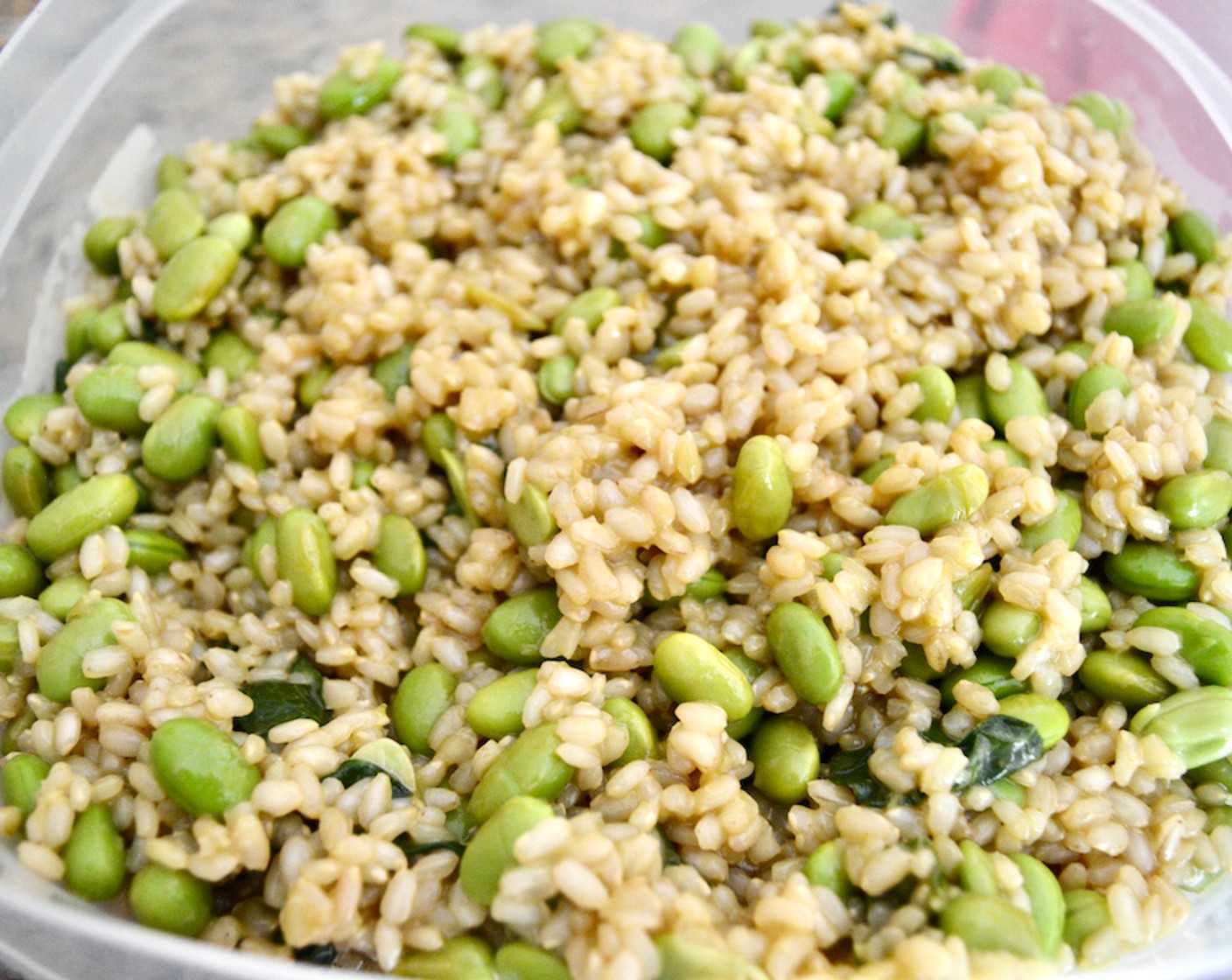 step 6 When the rice is done, add the edamame and bok choy mixture and stir well. Pour in the sauce and stir that in thoroughly as well.