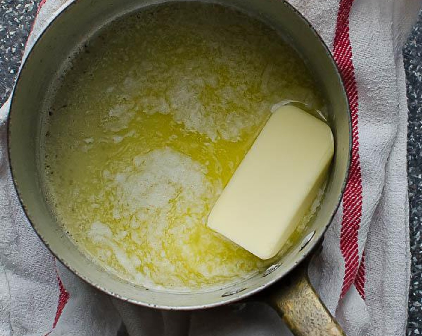 step 3 Melt the Unsalted Butter (1/4 cup) in a small saucepan over medium high heat and add the Garlic (1 clove). Cook for about 1 to 2 minutes so that the butter is fragrant.
