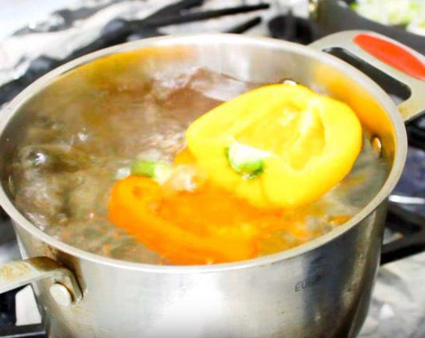 step 2 Meanwhile, into a pot with boiling water, add Assorted Color Bell Peppers (4). Cook for 5 minutes to soften.