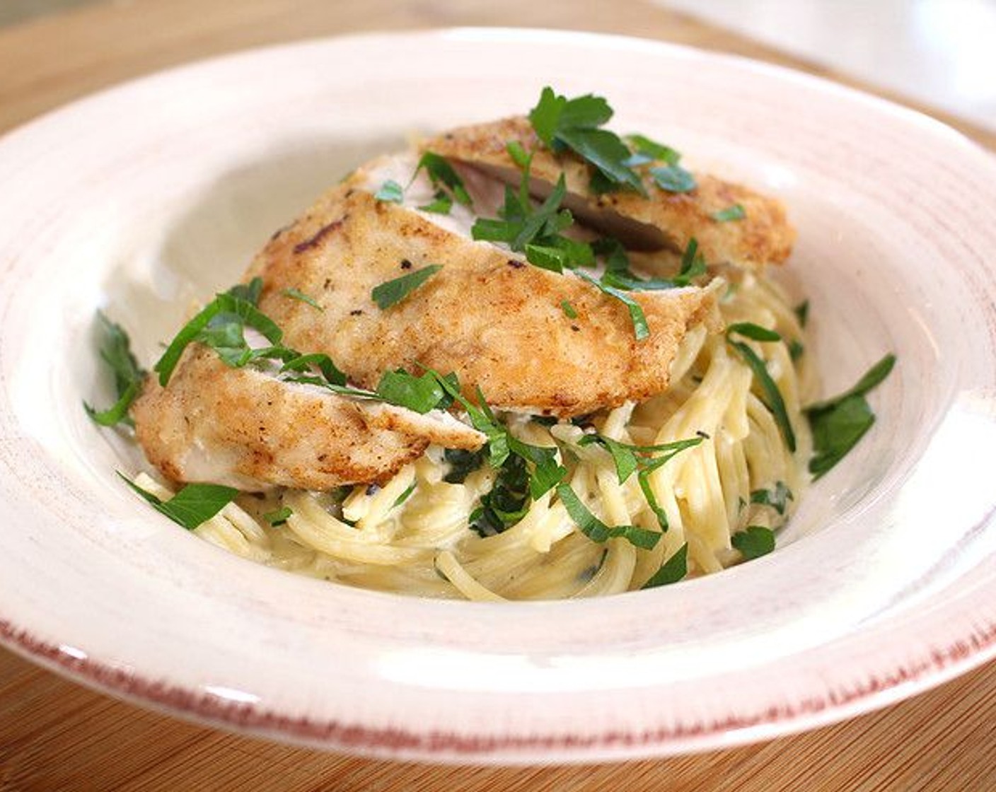 step 8 Serve pasta and sliced chicken on top. Garnish with additional parsley. Enjoy!