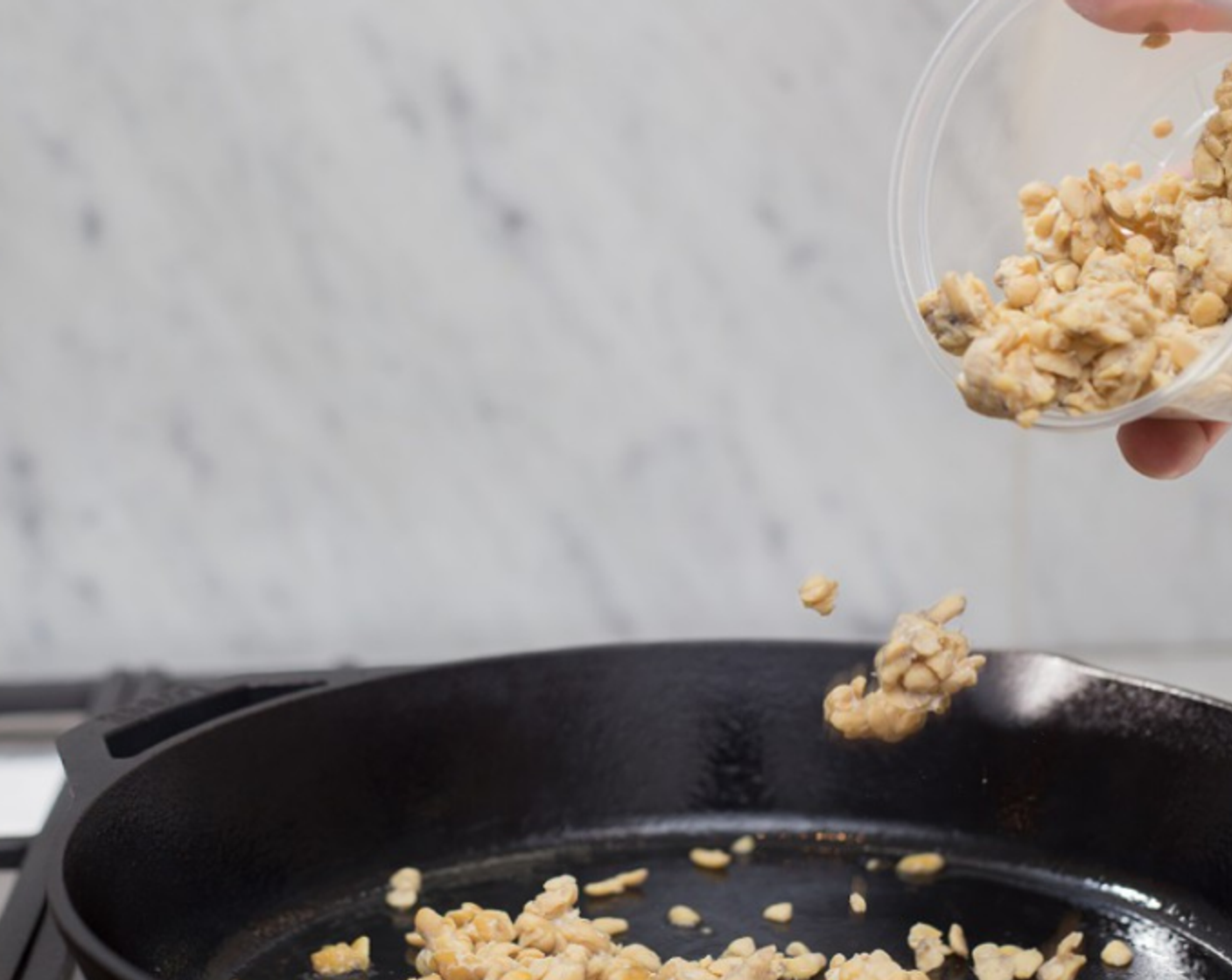 step 5 Place a large skillet over medium heat. Add Olive Oil (1 tsp). When oil is shimmering, add tempeh. Cook without stirring or turning until brown on first side, 2-3 minutes.