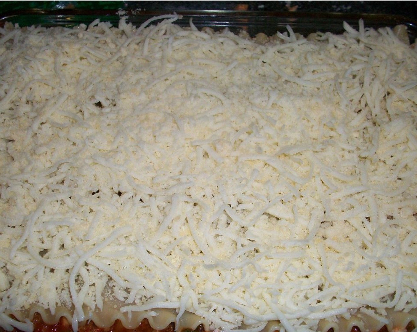 step 5 Layer three sheets of pasta in a 9x13-inch baking dish. Spoon half the ricotta mixture evenly on top of pasta. Add half the meat and veggie mixture on top of the cheese. Repeat with the remainder of pasta, cheese and meat and veggie mixtures. Spread Mozzarella Cheese (2 cups) evenly over the last pasta layer.