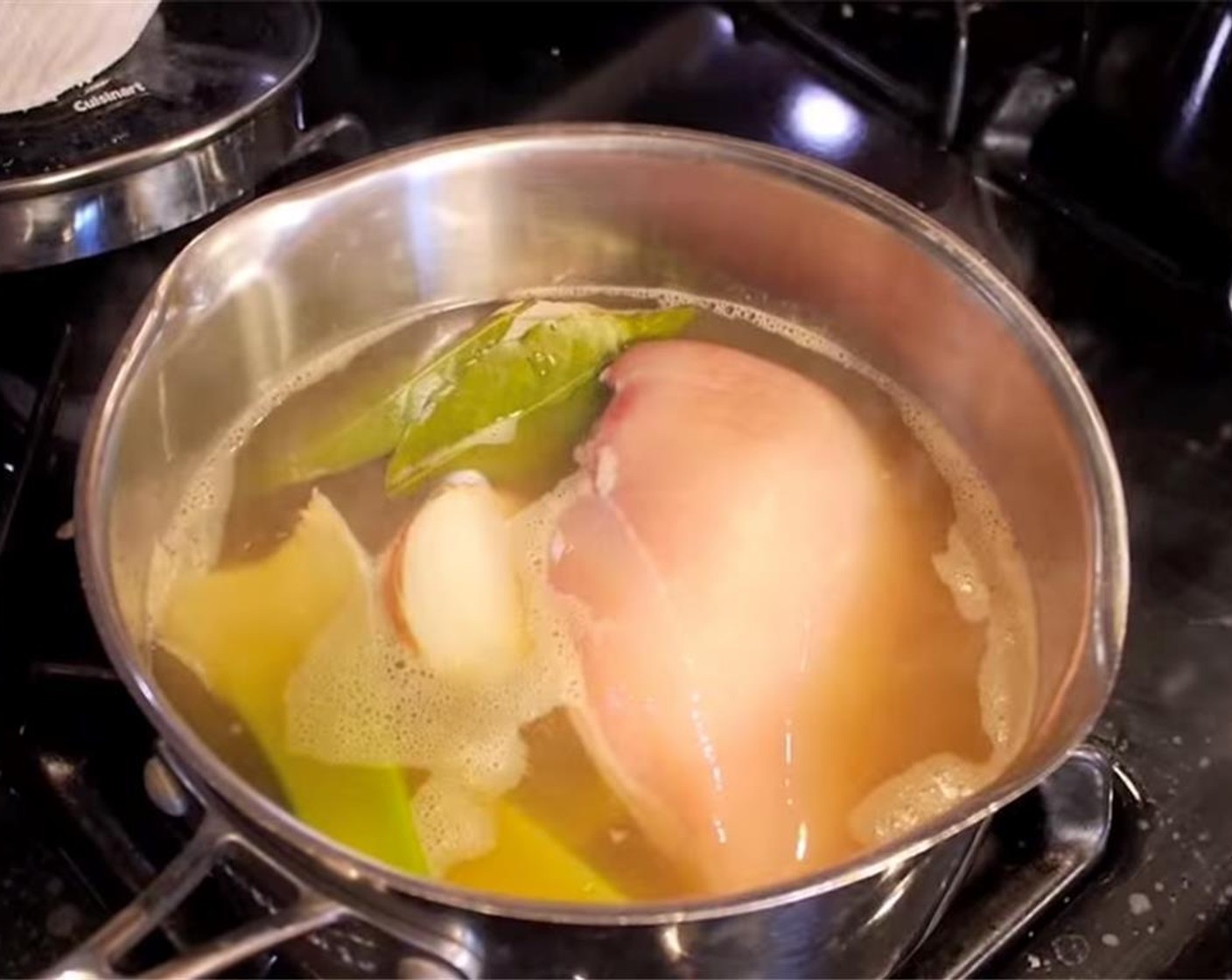 step 4 Heat some Oil (as needed) in a soup pot, then add onions and garlic. Cook until golden. Heat Chicken Stock (4 cups) in a separate pot, then add Chicken Breast (1). Cover pot and cook on medium-low heat until cooked through, 20-25 minutes.