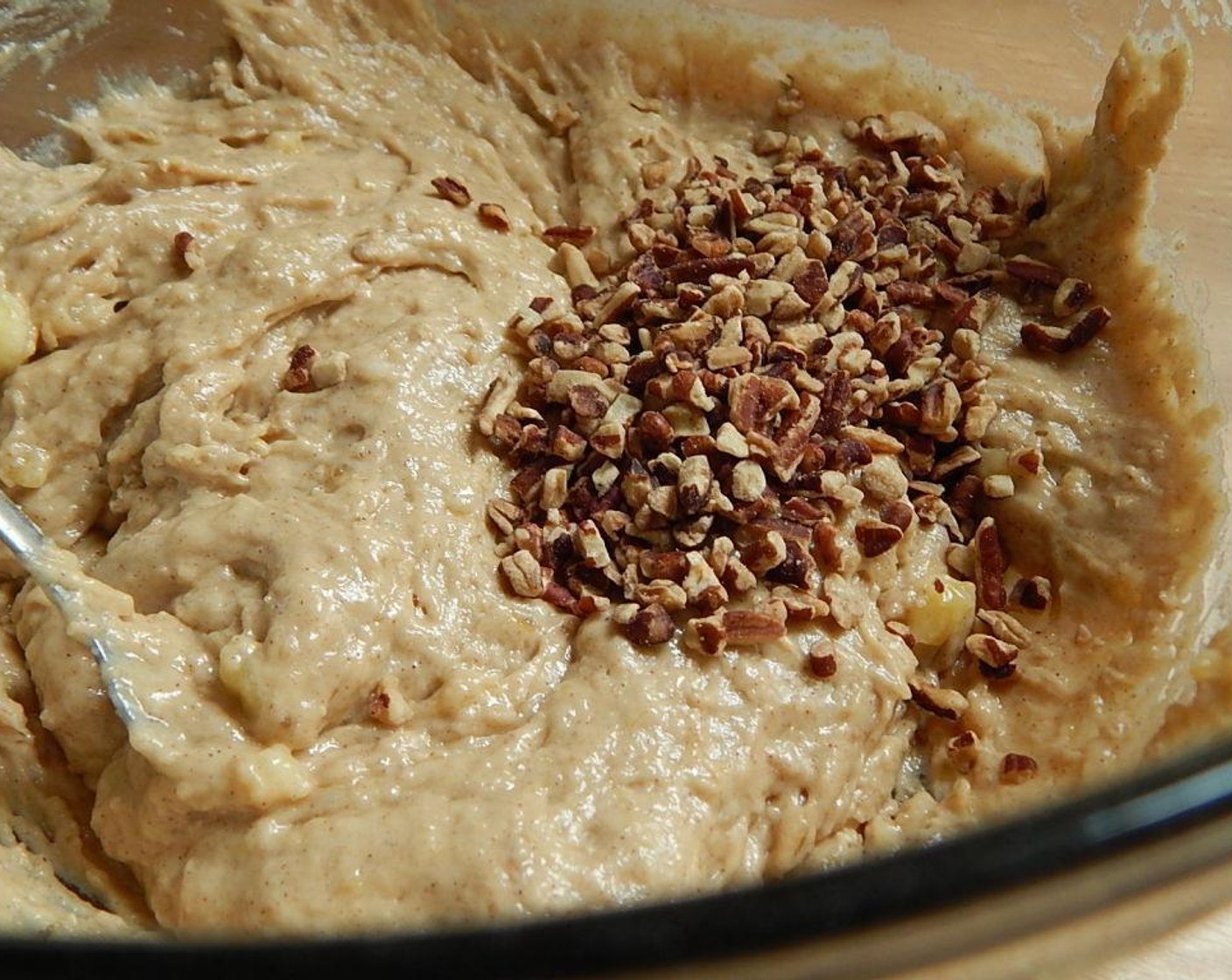 step 4 Pour your wet mixture into your dry and stir well. Add in the Pecans (2 Tbsp), but reserve the 1 Tbsp for later. Fold together and then pour into your loaf pan.