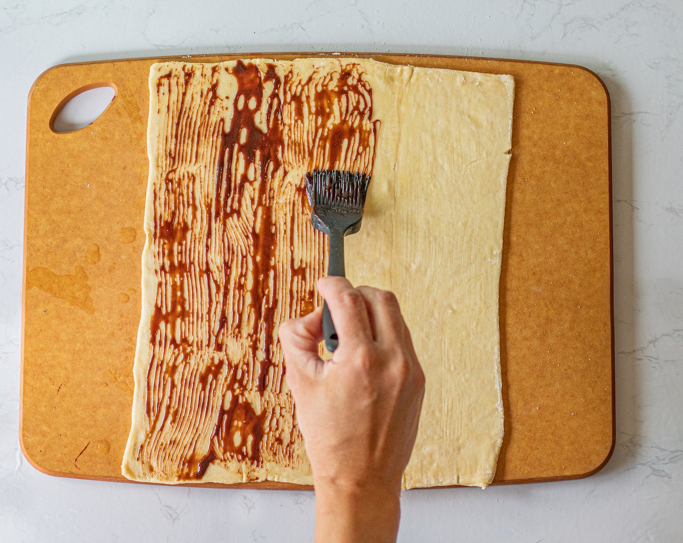 step 4 Next, brush a layer of Chocolate Syrup (1/2 cup) over the butter.