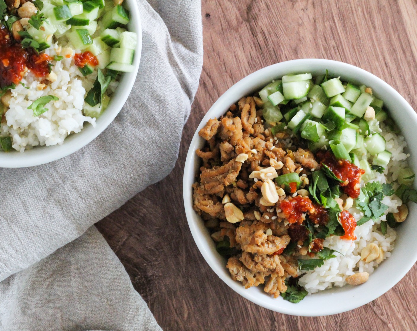 step 6 To serve, divide rice into bowls and top with the sweet and spicy chicken. Add Cucumber (1), Peanuts (1/4 cup), sliced green scallions, and Fresh Cilantro (2 Tbsp).