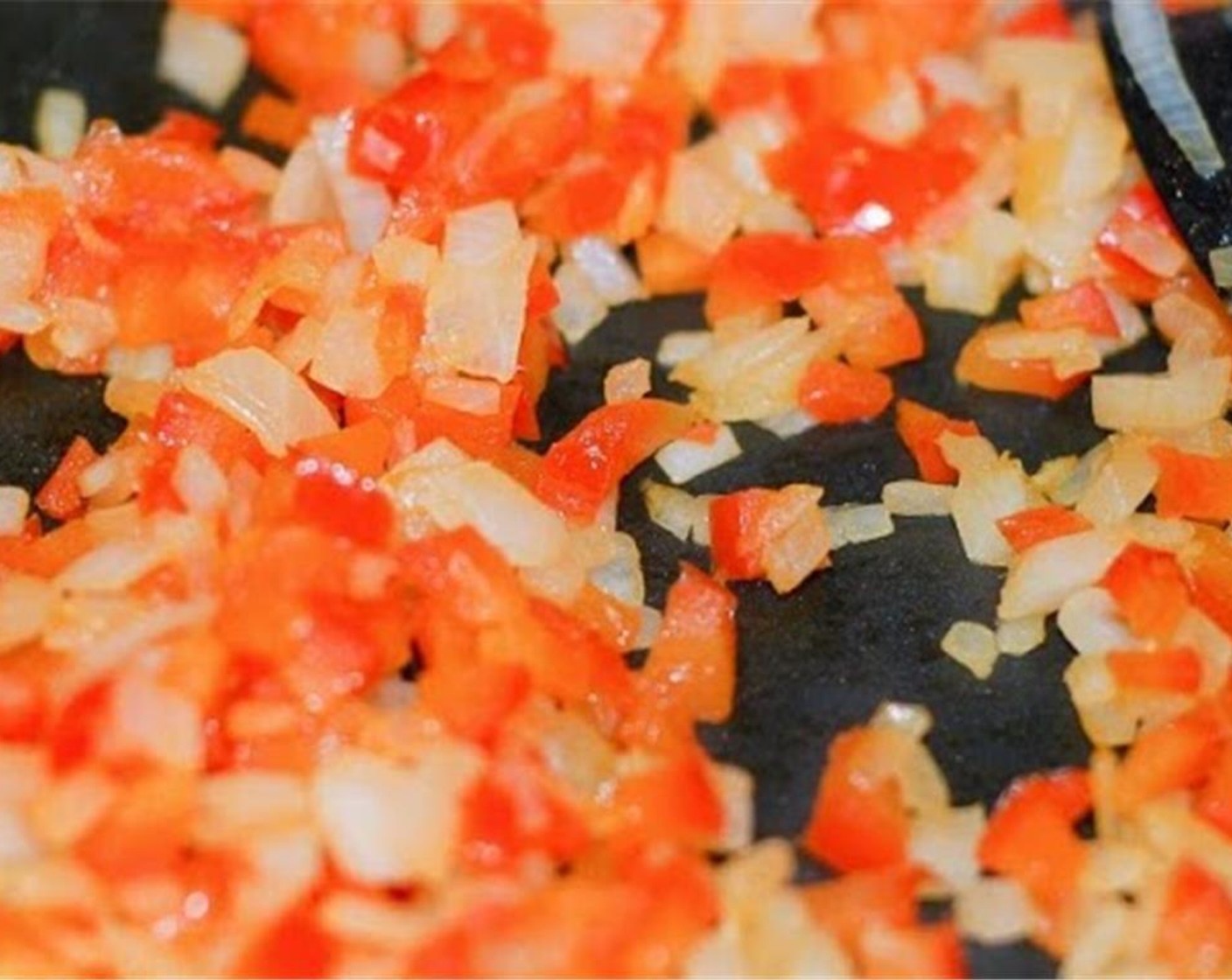 step 3 In a medium skillet over medium/medium low heat, add Vegetable Oil (1/2 Tbsp) and let warm up for 1-2 minutes. Add the finely chopped onion and red bell pepper and cook until soft, 6-8 minutes. Then remove from pan and set aside.