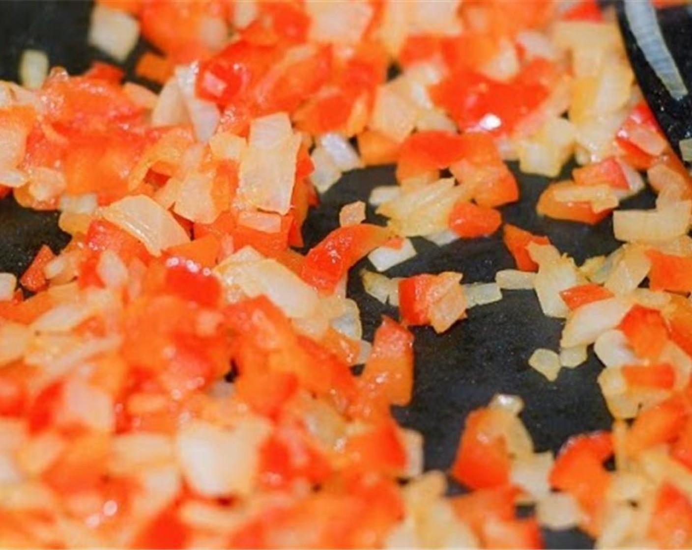 step 3 In a medium skillet over medium/medium low heat, add Vegetable Oil (2 tsp) and let warm up for 1-2 minutes. Add the finely chopped onion and red bell pepper and cook until soft, 6-8 minutes. Then remove from pan and set aside.