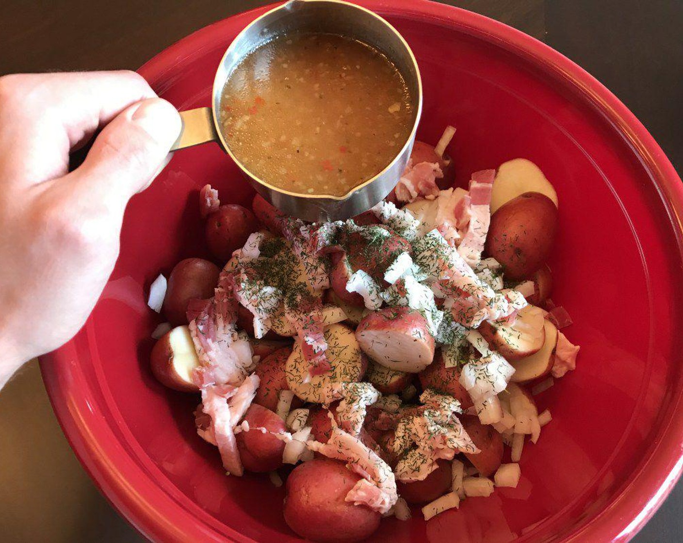 step 6 In a large bowl, combine potatoes, Onion (2/3 cup), bacon, Dried Dill Weed (1/2 tsp) and Ground Black Pepper (1/4 tsp). Pour Italian Dressing (2/3 cup) on top. Mix until the potatoes are evenly coated with the dressing.