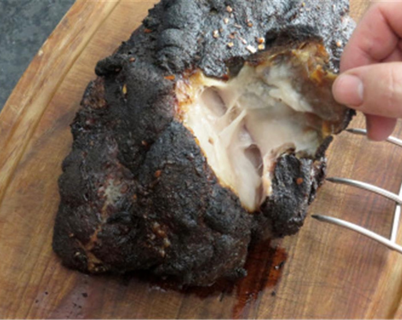 step 13 Transfer the cooked pork to a cutting board and cover loosely with aluminum foil to let it rest for about 15 minutes. Wearing rubber gloves, remove the skin and fat, chop up what you want to add back to the pork. Pull the pork into shreds.