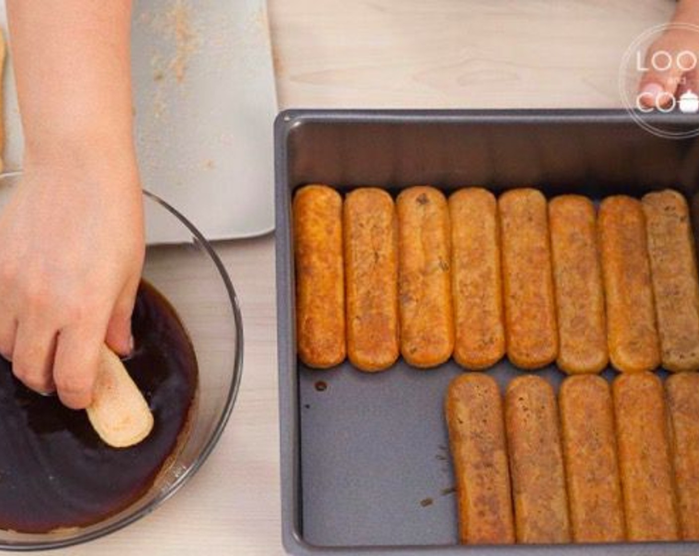 step 9 To assemble: use a loose base square tin, soak Ladyfingers (1 pckg) in th espresso coffee and line the bottom of the tin.