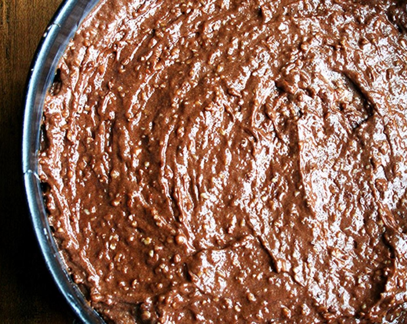 step 9 Pour the batter into the prepared cake pan and smooth the top. Put the pan on a cookie sheet and bake for 90 minutes.