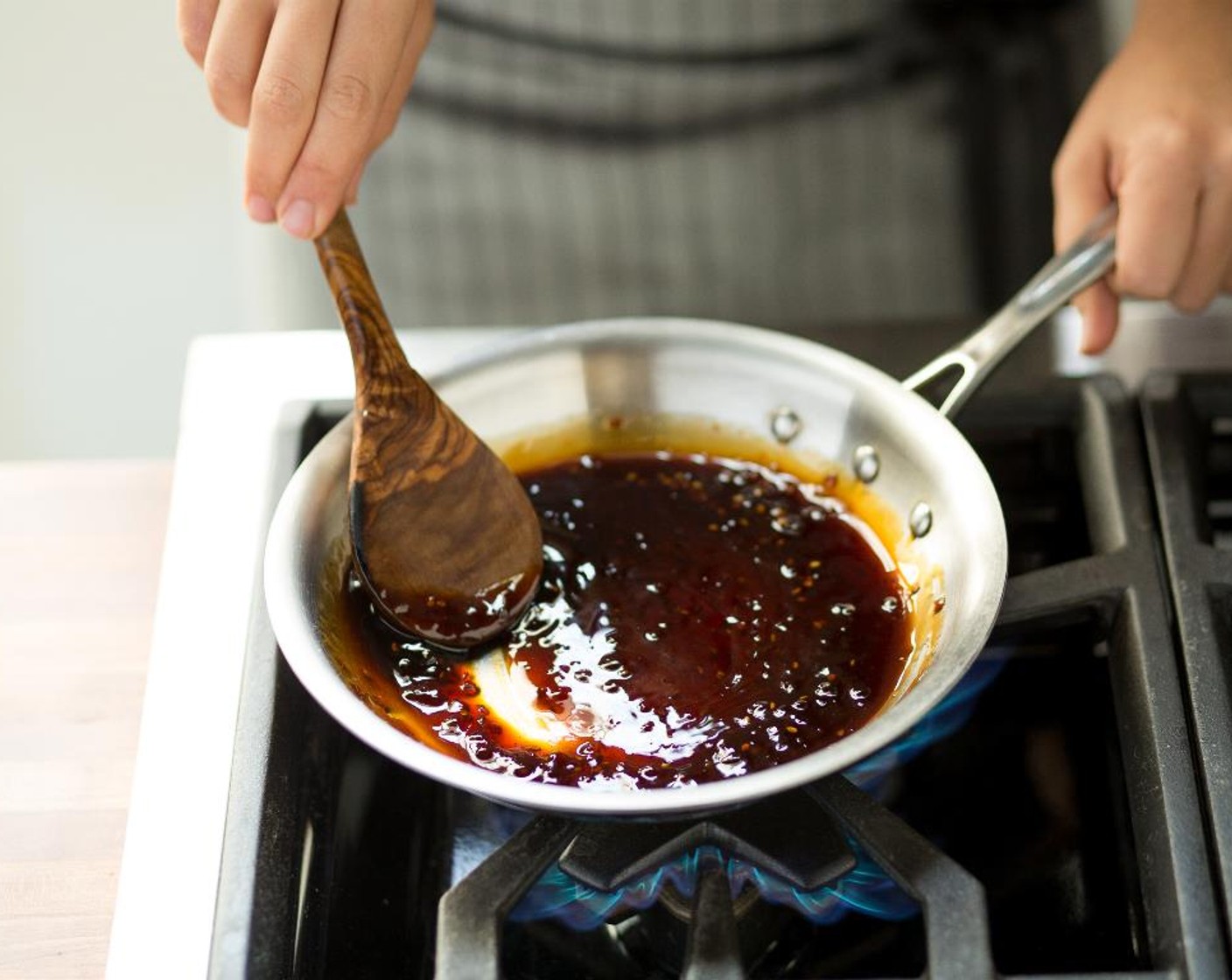 step 9 As soon as it begins to boil, reduce heat to low and simmer until the sauce has thickened and reduced by half; about 3 to 4 minutes. Stir in the Honey (3 Tbsp).