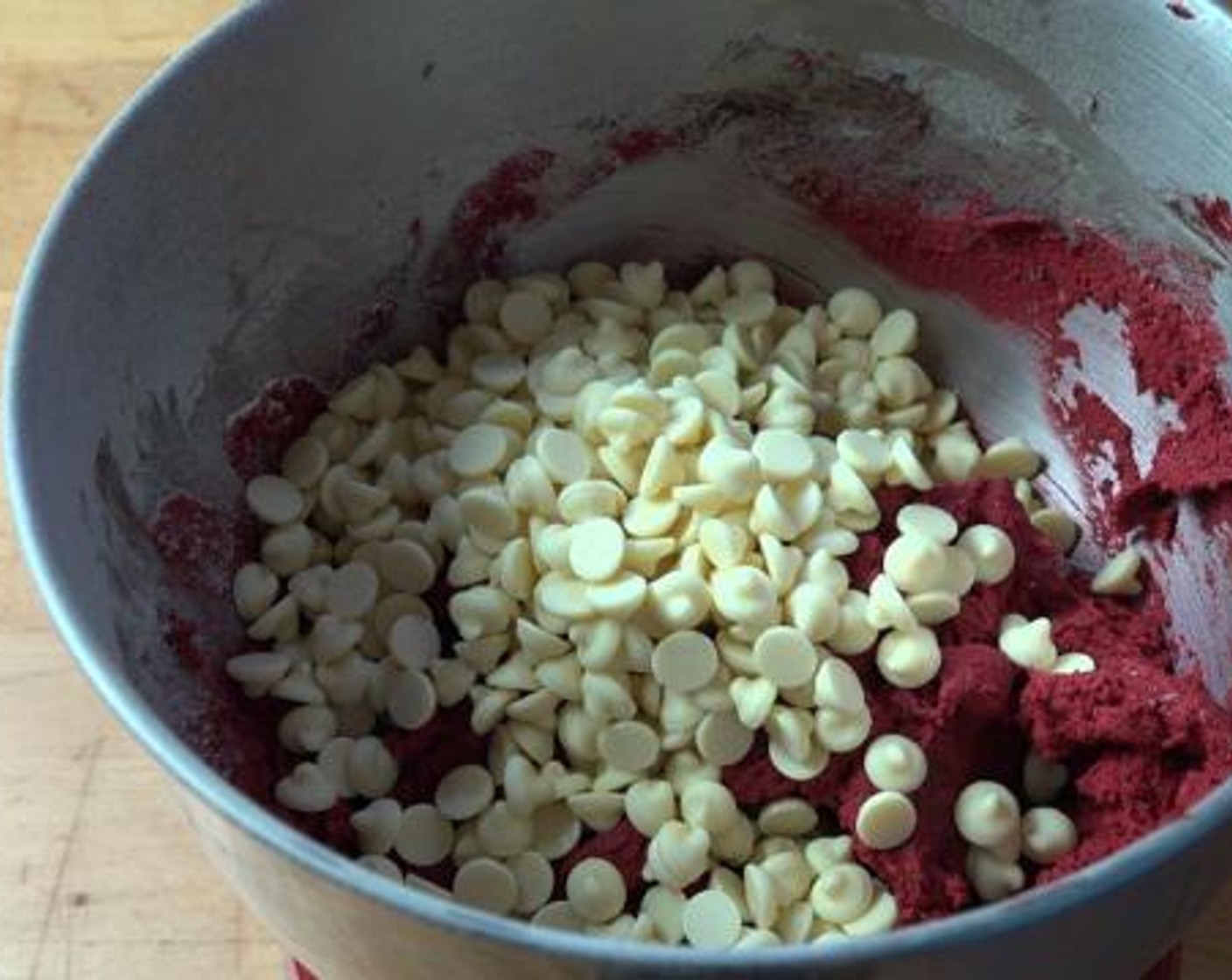 step 4 While the mixer is beating, Slowly add the Self-Rising Flour (3/4 cup). After everything is mixed well, fold in the White Chocolate Chips (1 1/2 cups) into the dough.