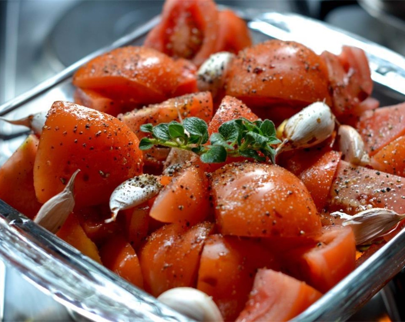 step 1 In a roasting pan, arrange the Tomatoes (8), Garlic (6 cloves), and Yellow Onion (1). Drizzle with Olive Oil (4 Tbsp), Balsamic Reduction (1 Tbsp), and Dry Red Wine (100 mL).