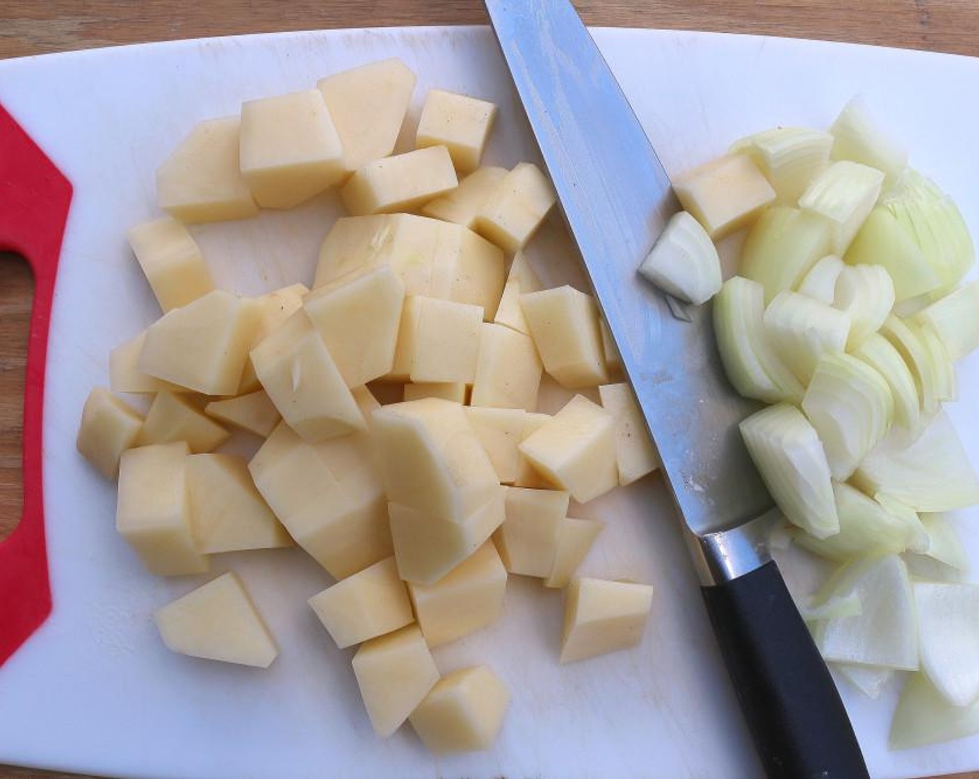 step 1 Cut Potatoes (2) and White Onion (1) into medium-sized cubes.