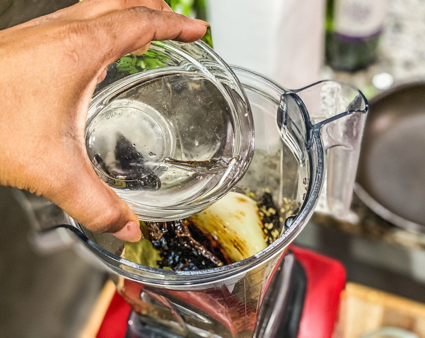 step 3 In a blender add the guajillo, onion, garlic, Dried Oregano (1 tsp), Bay Leaves (2), Kosher Salt (1 Tbsp), Ground Black Pepper (1/2 Tbsp), Ground Cumin (1/2 Tbsp), Distilled White Vinegar (1/2 cup), and Water (1 cup). Blitz on high for 1 minute.