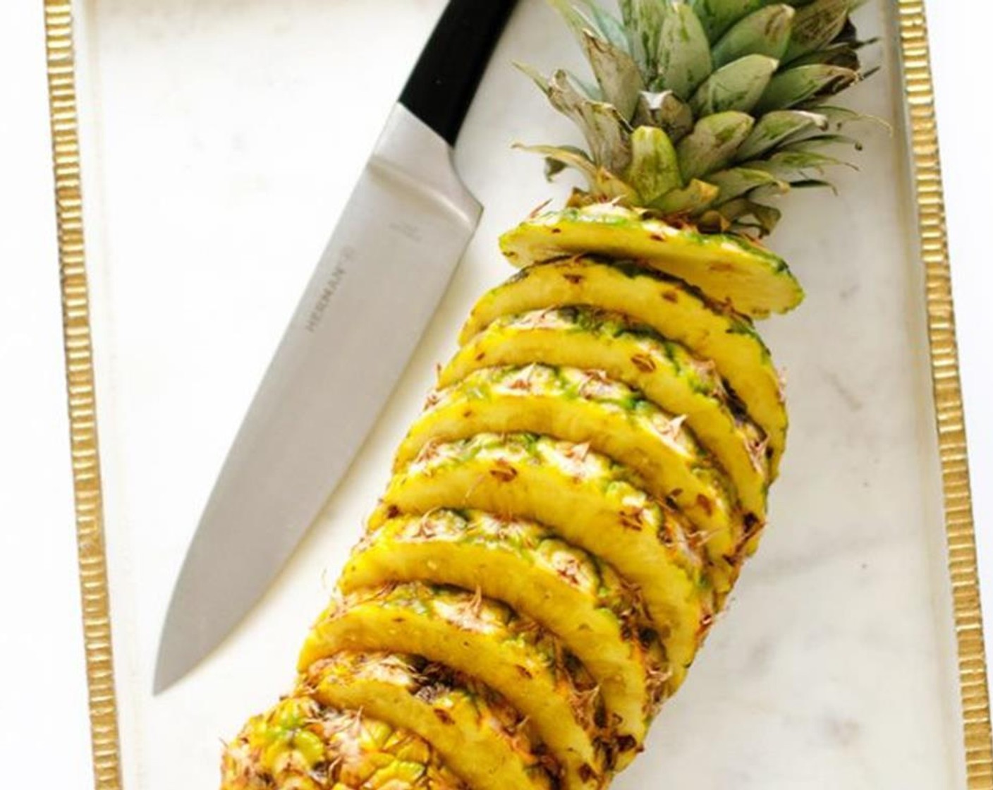 step 1 Cut the Pineapple (1) into 3/4 inch slabs, leaving the skin on as decoration or cutting it off.
