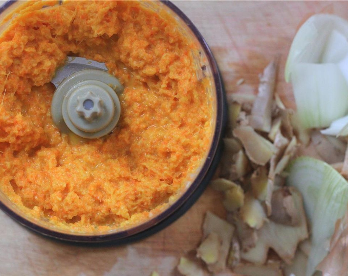 step 6 Make the dressing. In a food processor or blender, puree the Carrot (1), Fresh Ginger (2 in), and Yellow Onion (1/4) together as much as possible.