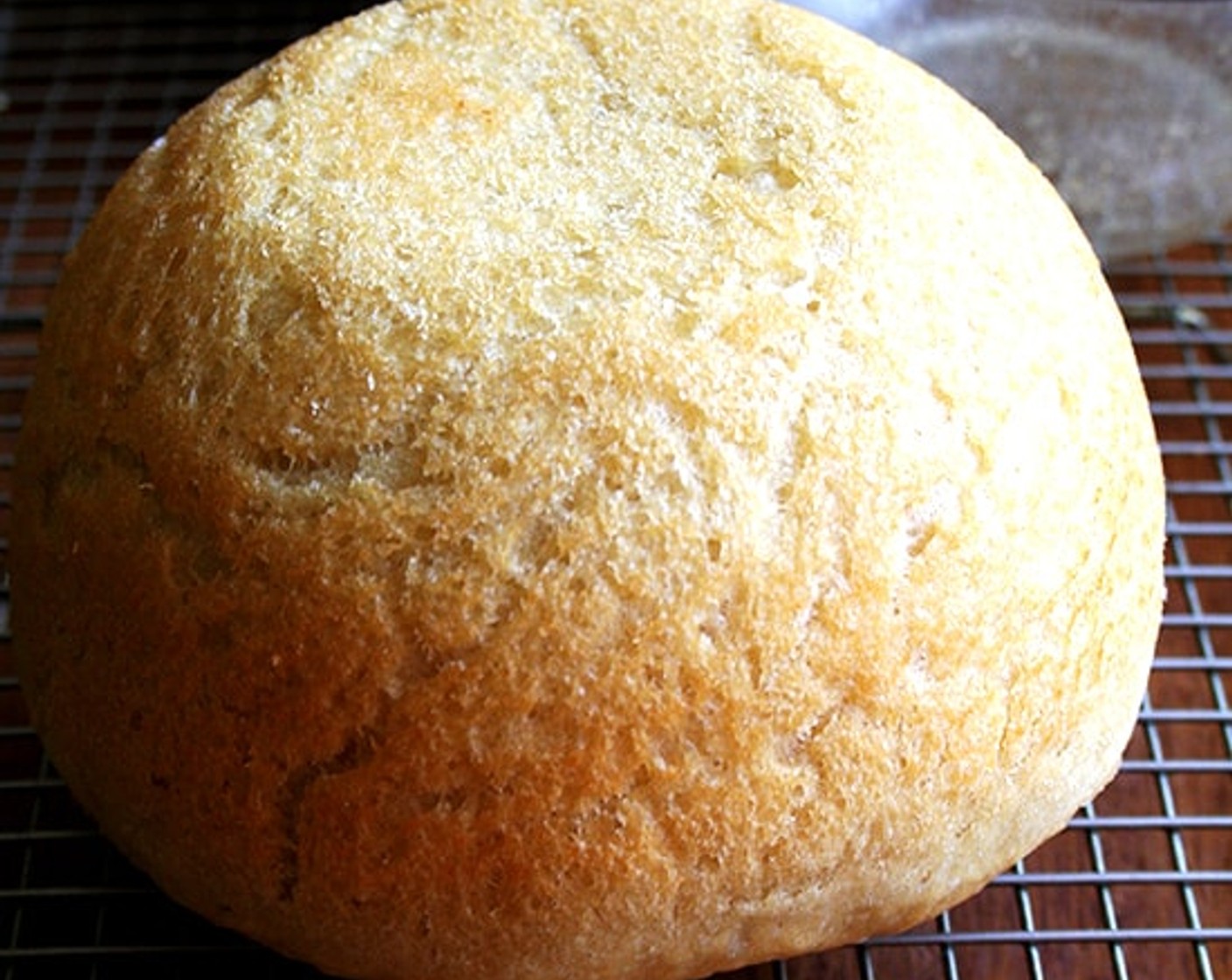 step 11 Remove from the oven and turn the loaves onto cooling racks. If the loaves look a little pale and soft when you've turned them out onto your cooling racks, place the loaves into the oven, outside of their bowls, and let them bake for about 5 minutes longer.