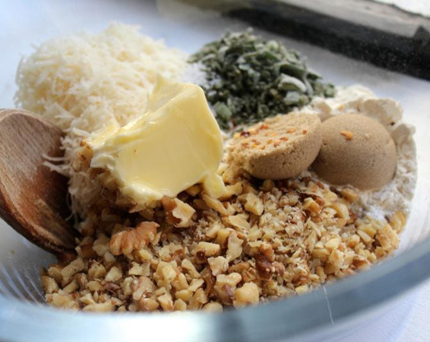 step 5 In a medium bowl, combine the Walnuts (1 1/2 cups), All-Purpose Flour (3/4 cup), Parmesan Cheese (1 cup), Fresh Sage (2 Tbsp), Crushed Red Pepper Flakes (1/4 tsp), Brown Sugar (2 Tbsp), the remaining Unsalted Butter (1/3 cup), and Kosher Salt (to taste) (1 tsp).